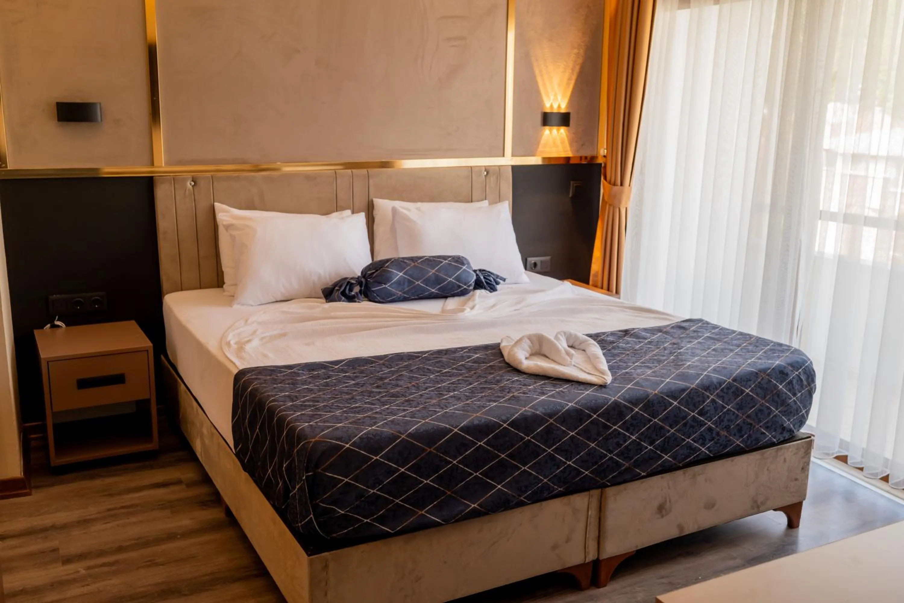 Bed in Arikan Inn Hotel