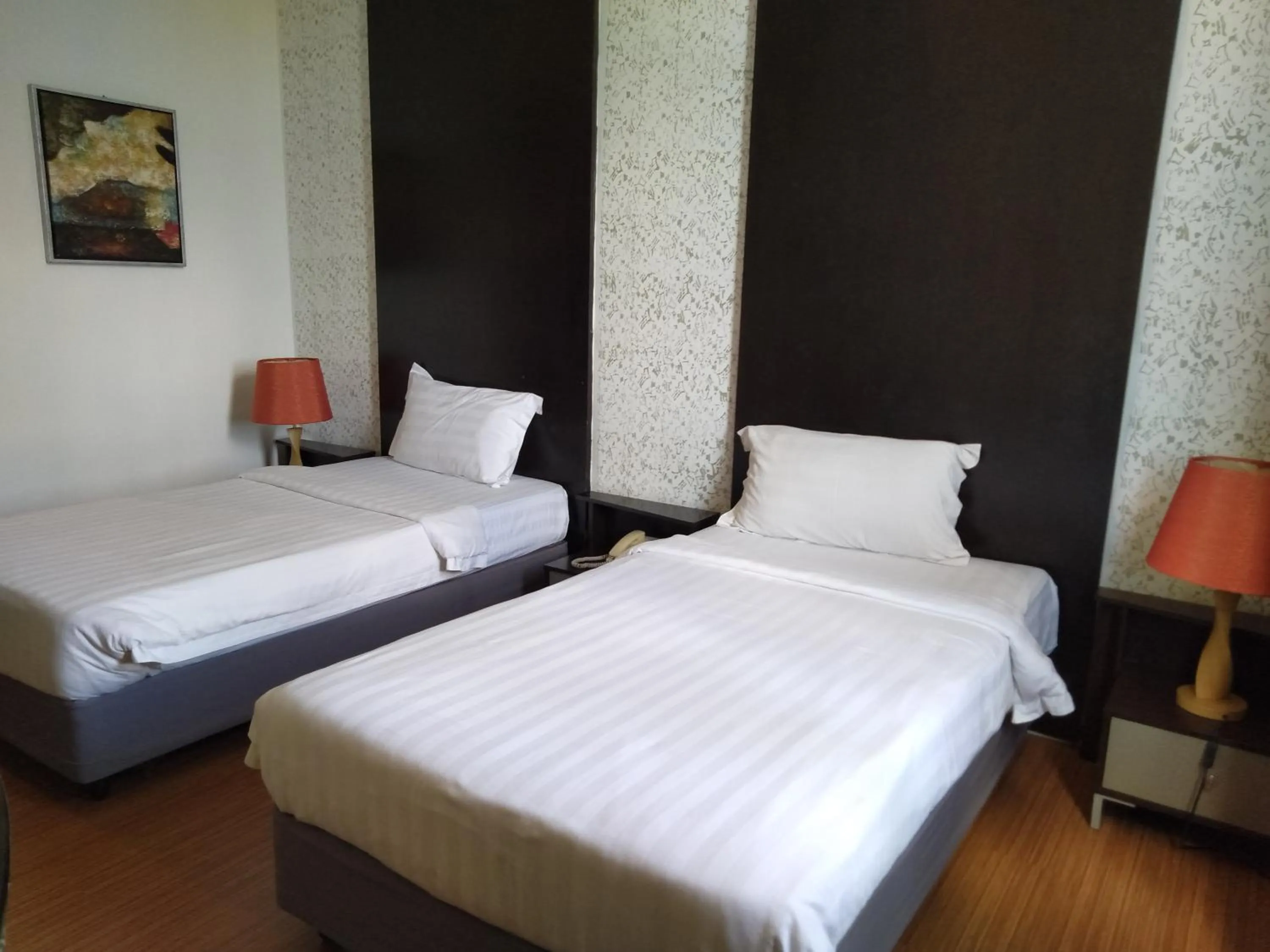 Bed in Ginasuite Hotel