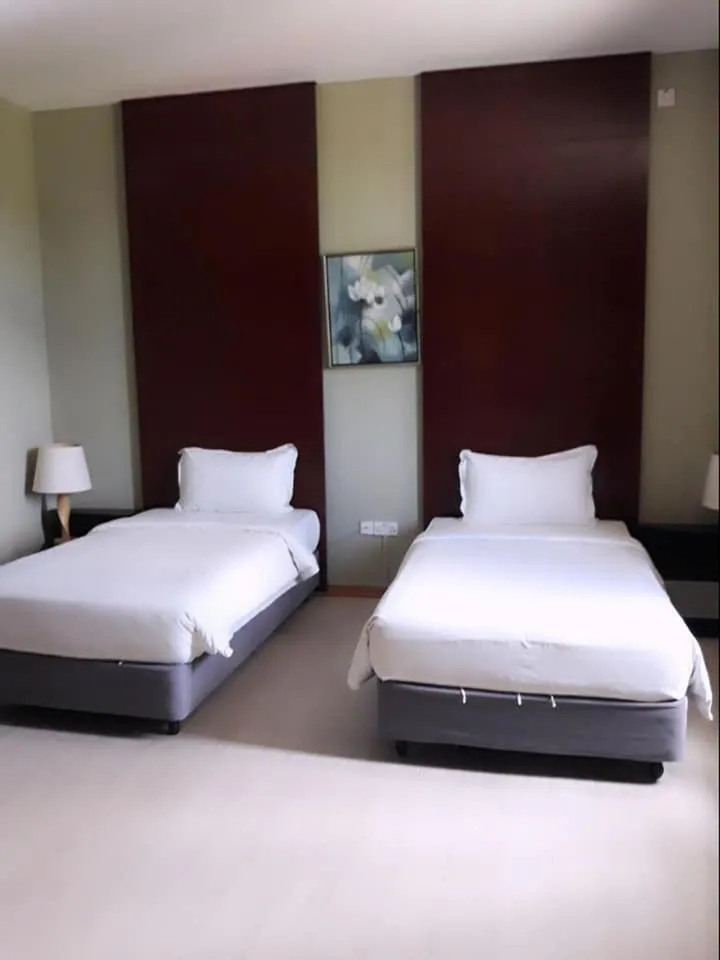 Bed in Ginasuite Hotel