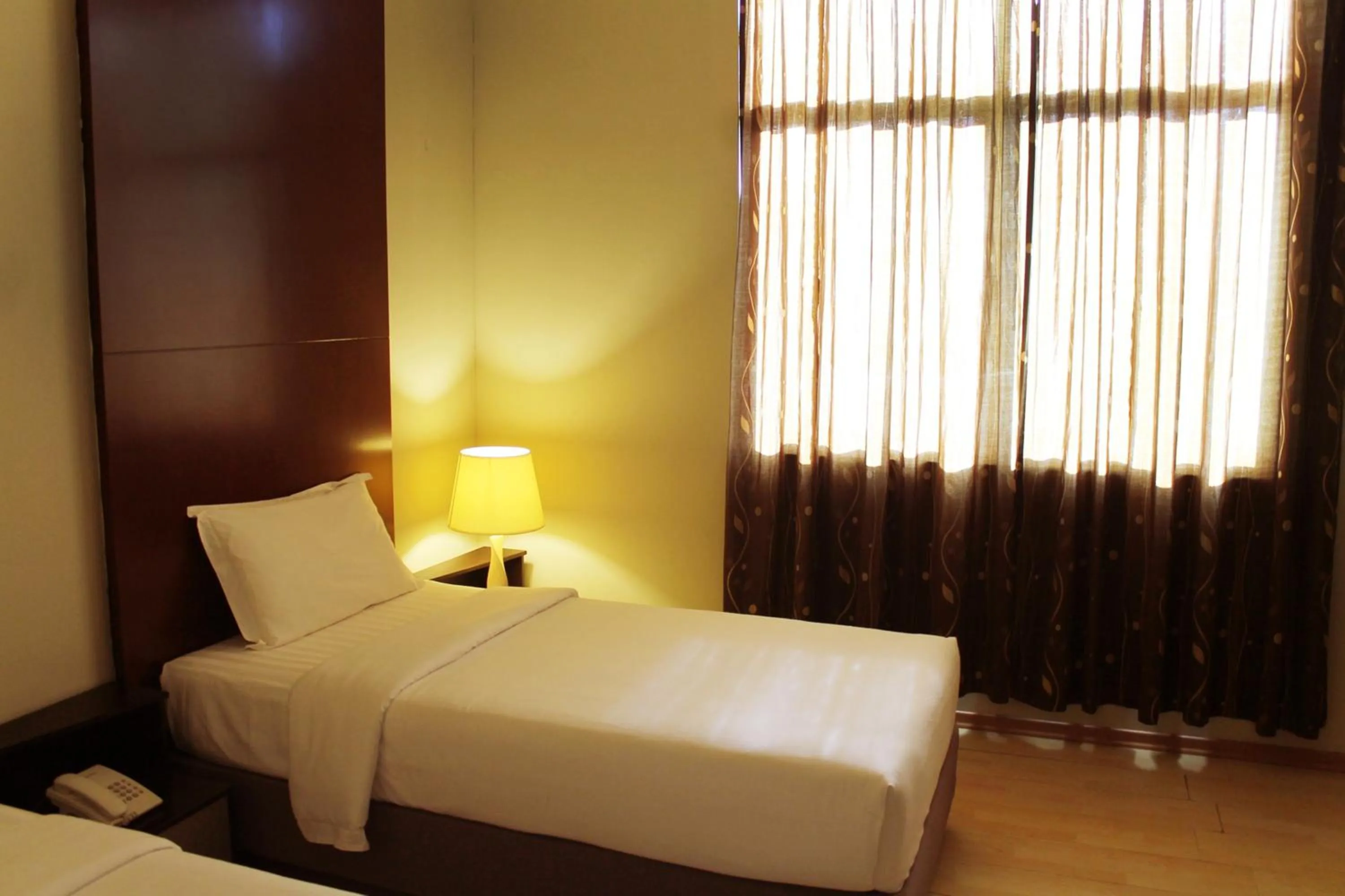 Bed in Ginasuite Hotel