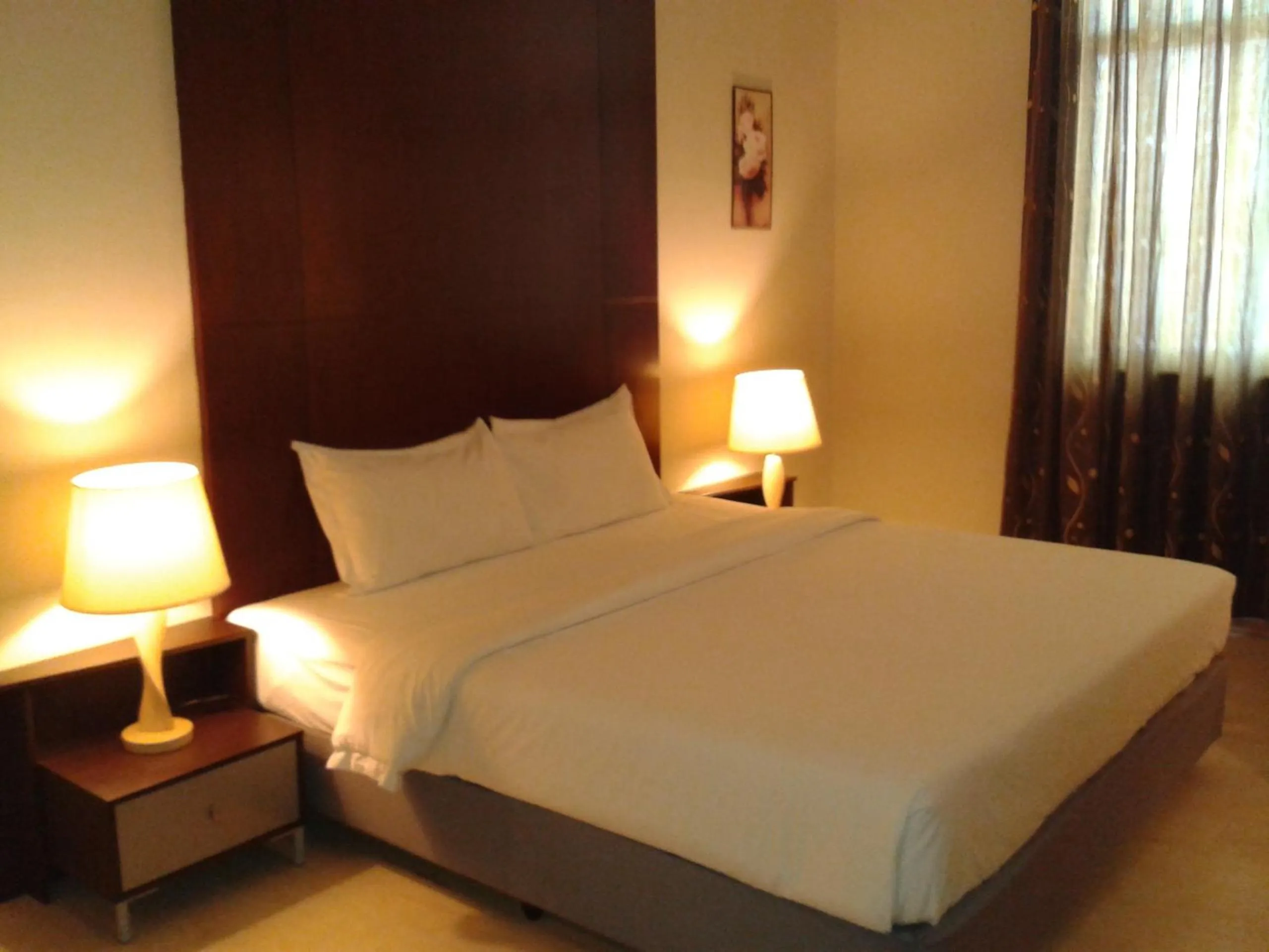 Bed in Ginasuite Hotel
