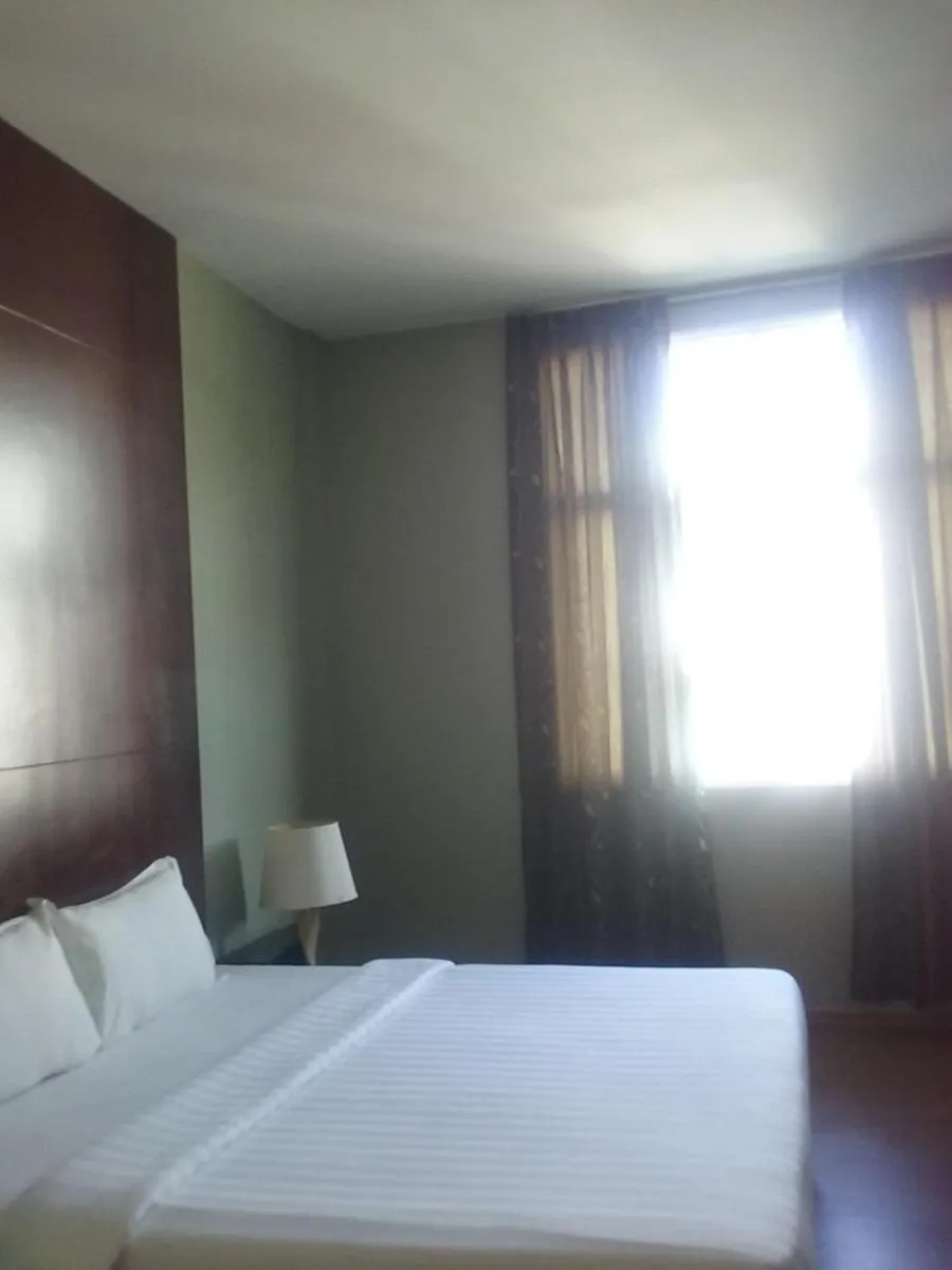 Bed in Ginasuite Hotel