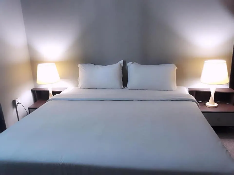 Bed in Ginasuite Hotel