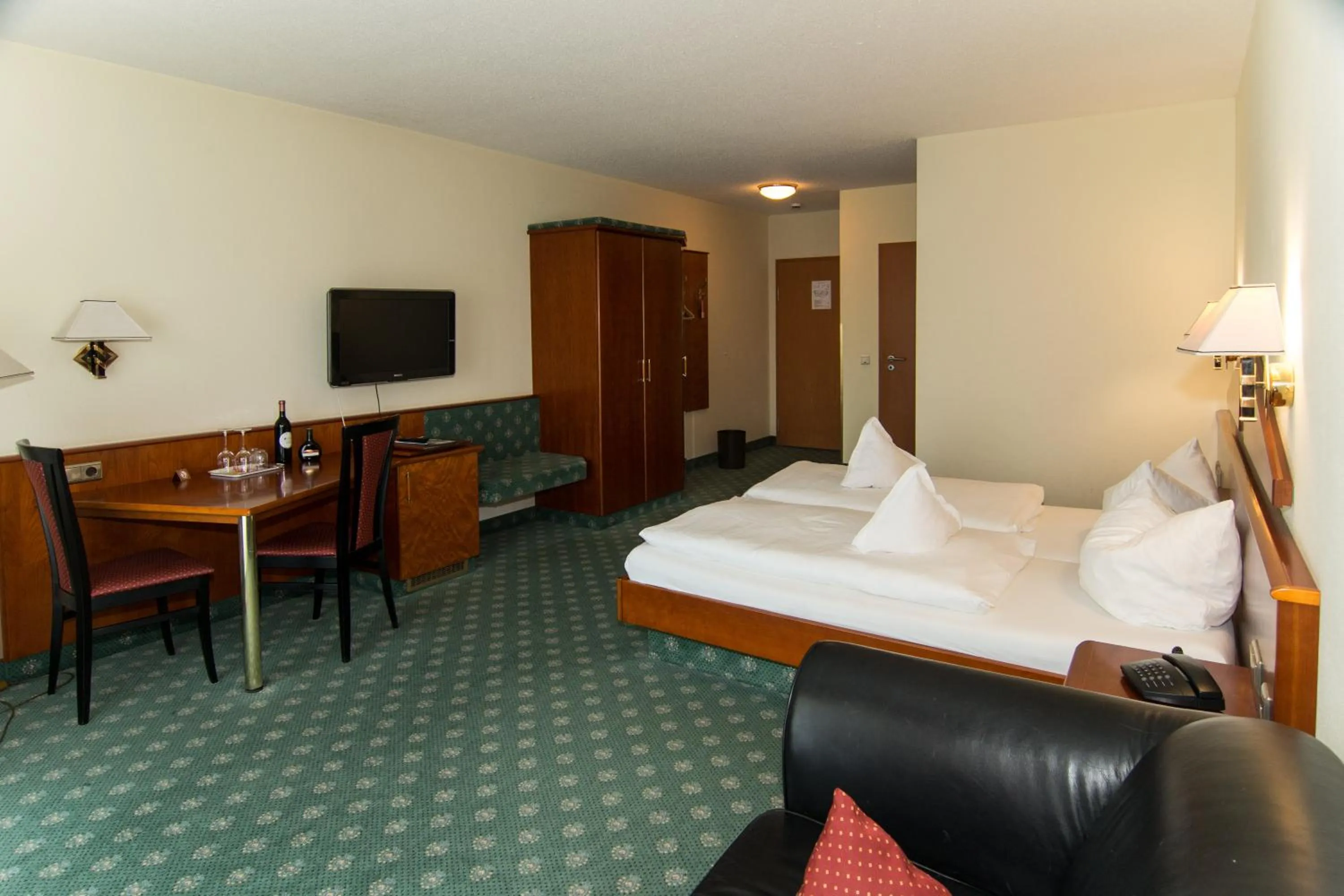 Photo of the whole room, Bed in Weinhotel Rose