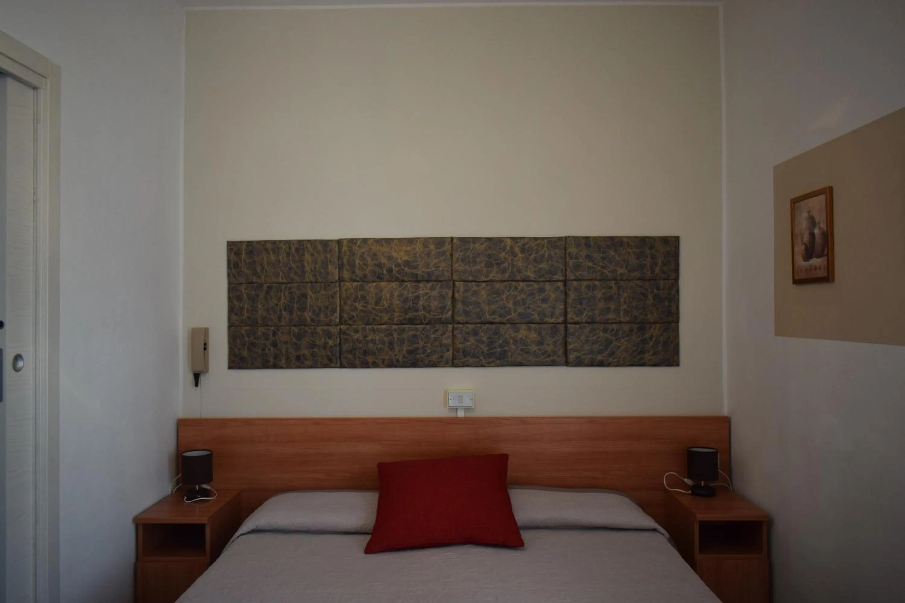 Bed in Albergo Al Pescatore