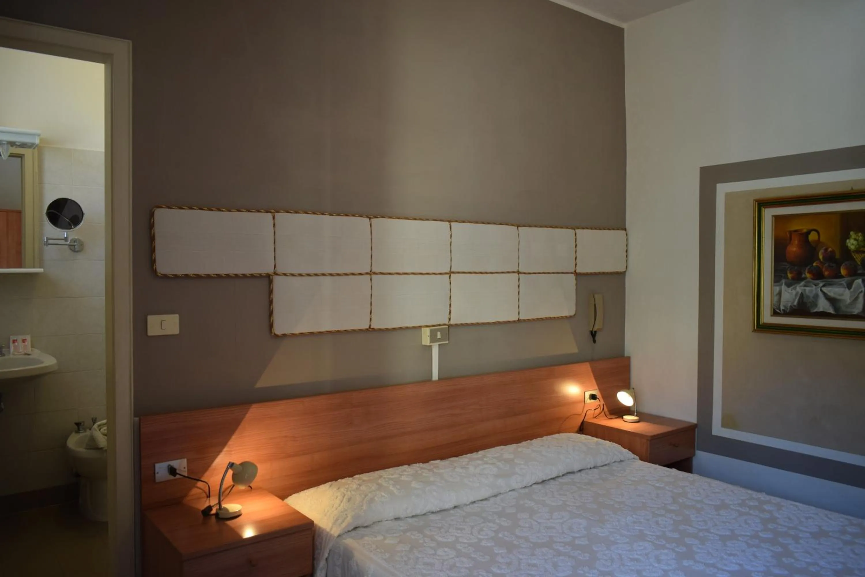 Bed in Albergo Al Pescatore