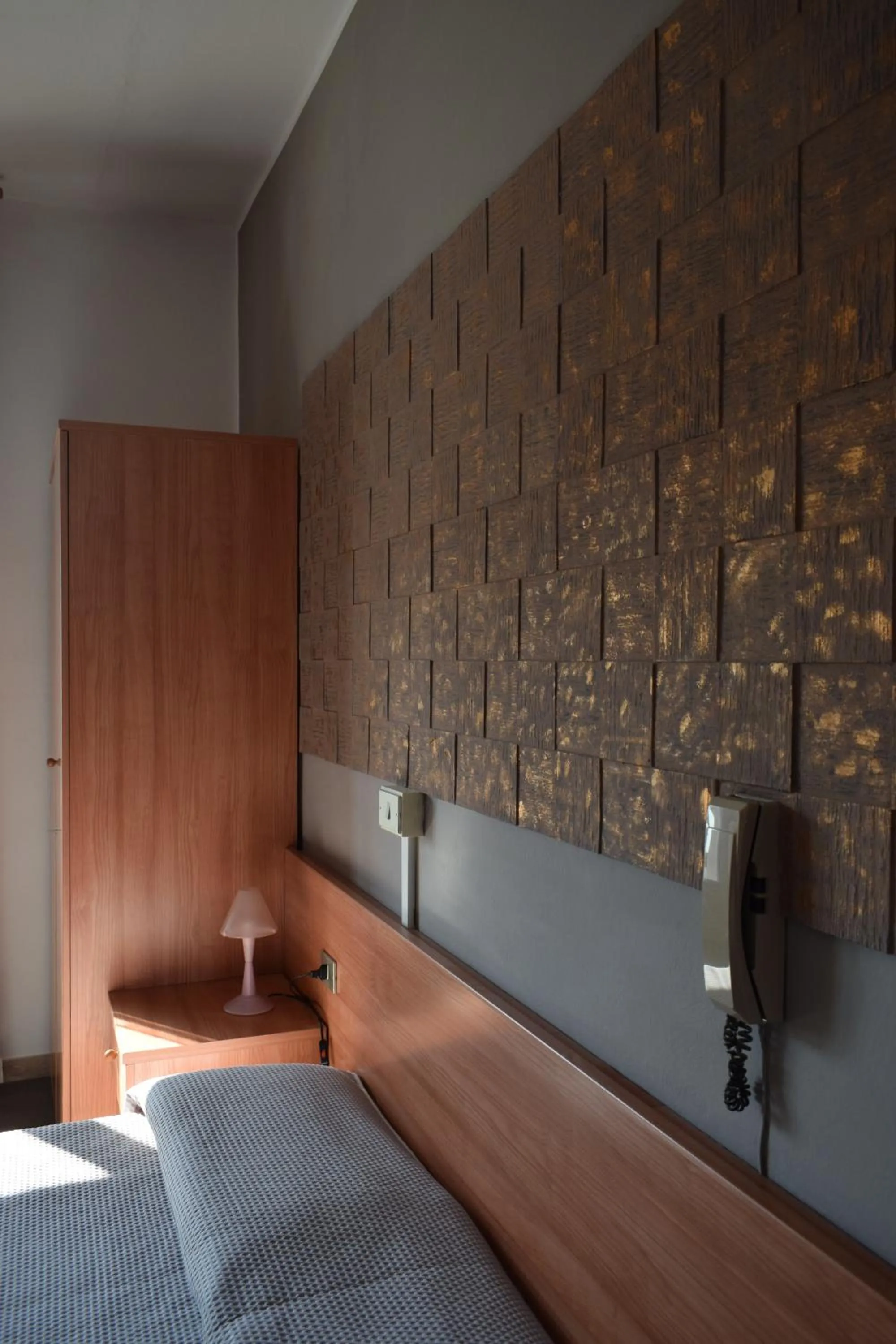 Decorative detail, Bed in Albergo Al Pescatore