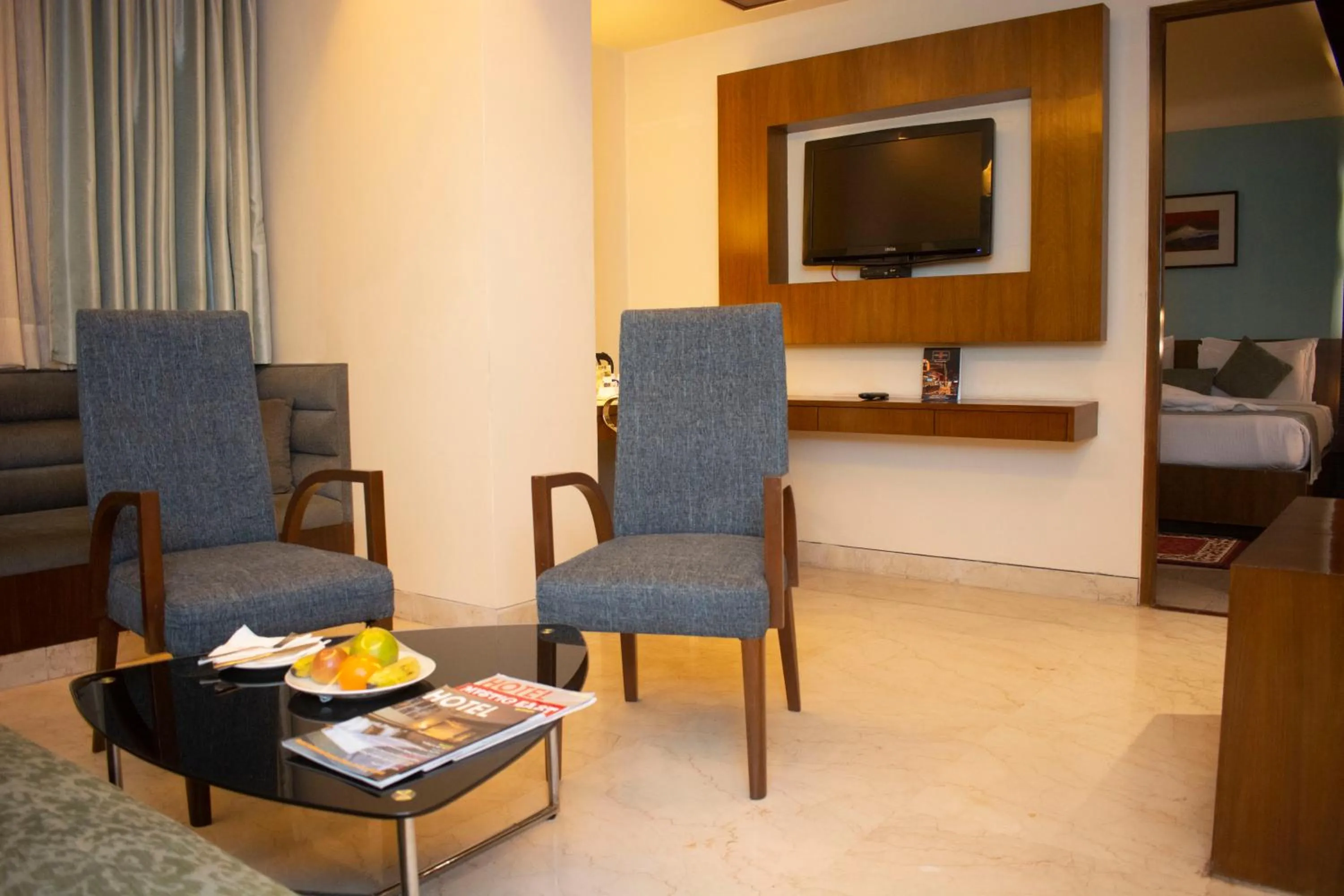 Communal lounge/ TV room in Regenta Orkos Kolkata by Royal Orchid Hotels Limited