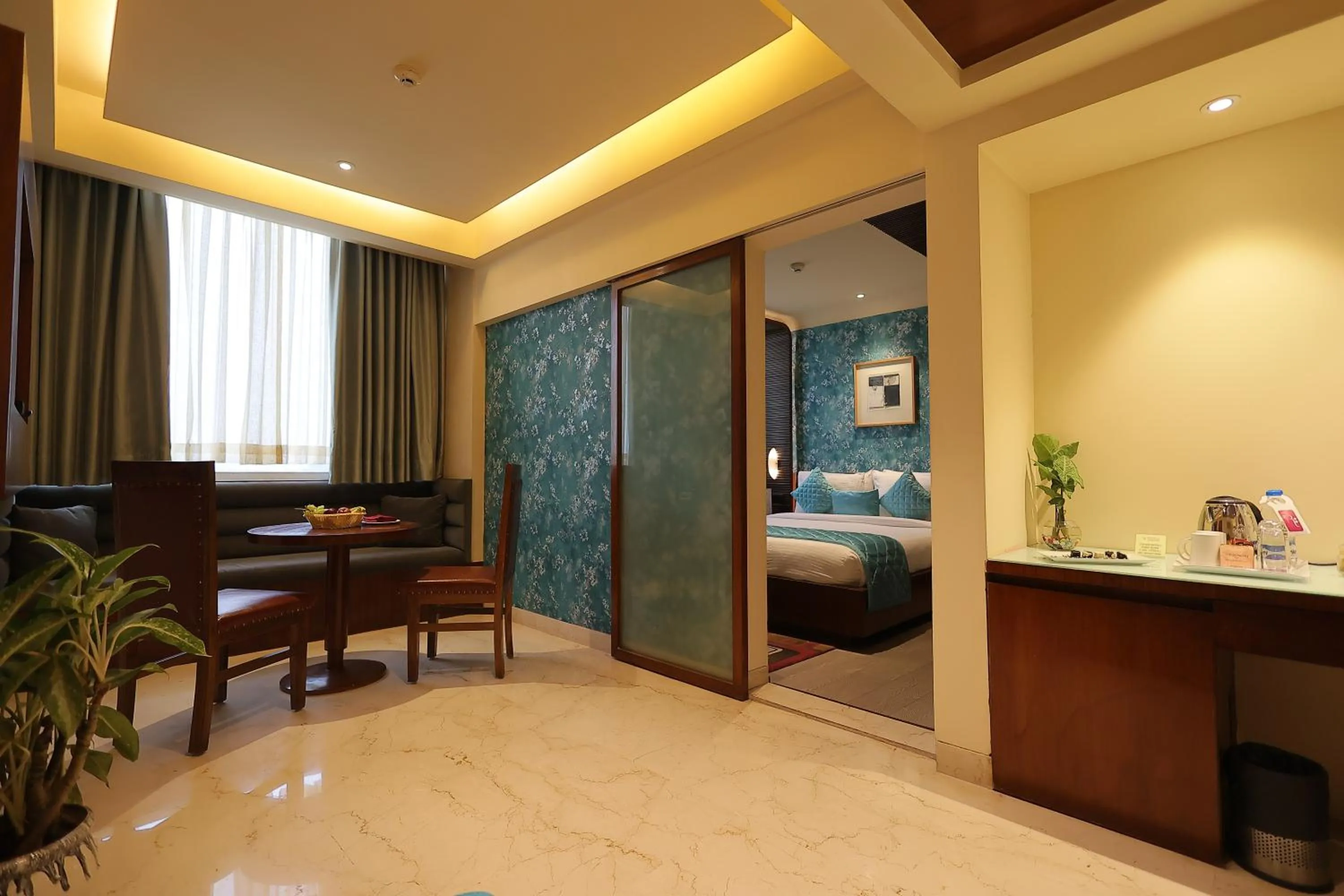 Living room, Bed in Regenta Orkos Kolkata by Royal Orchid Hotels Limited