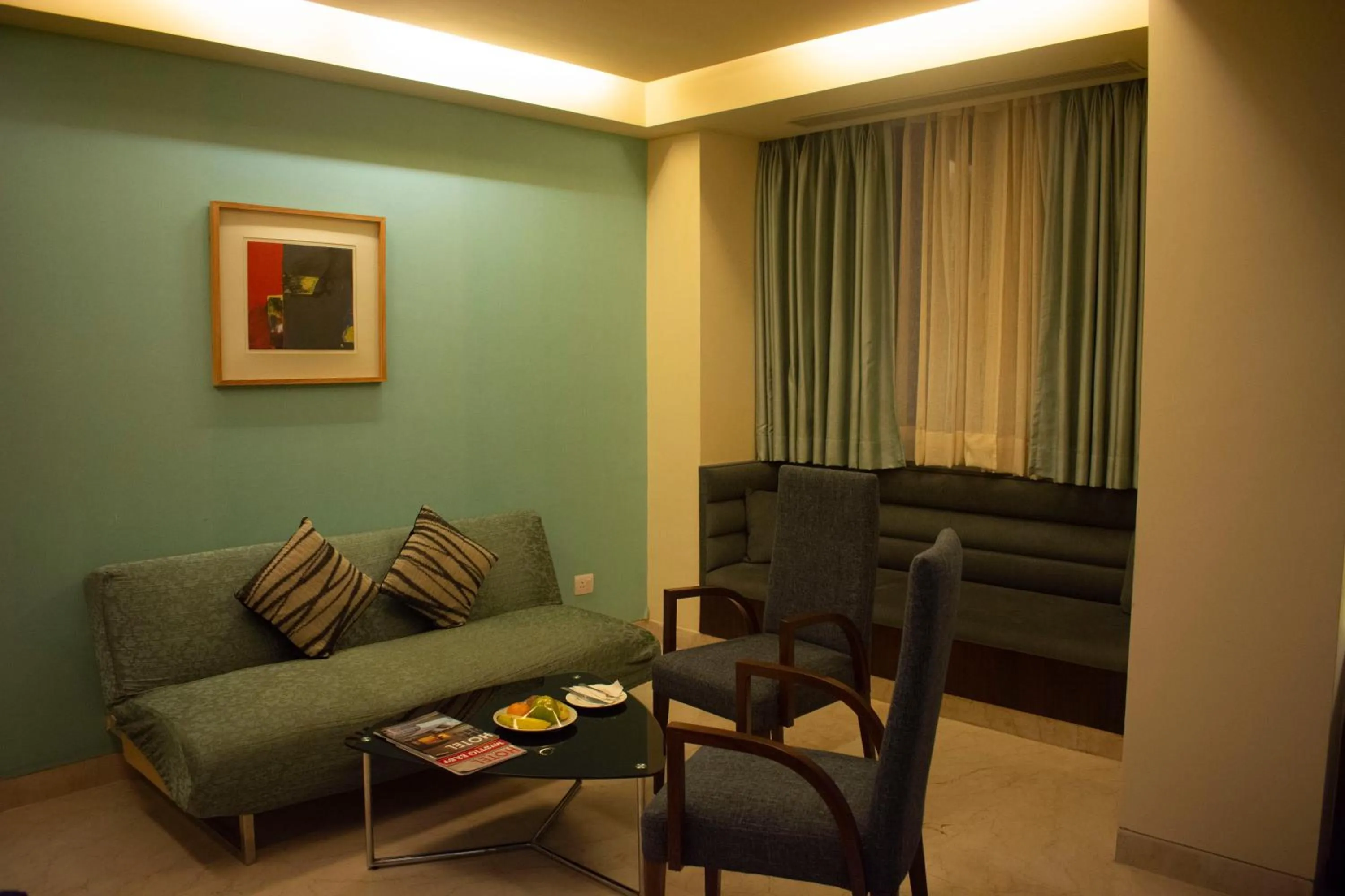 Living room in Regenta Orkos Kolkata by Royal Orchid Hotels Limited