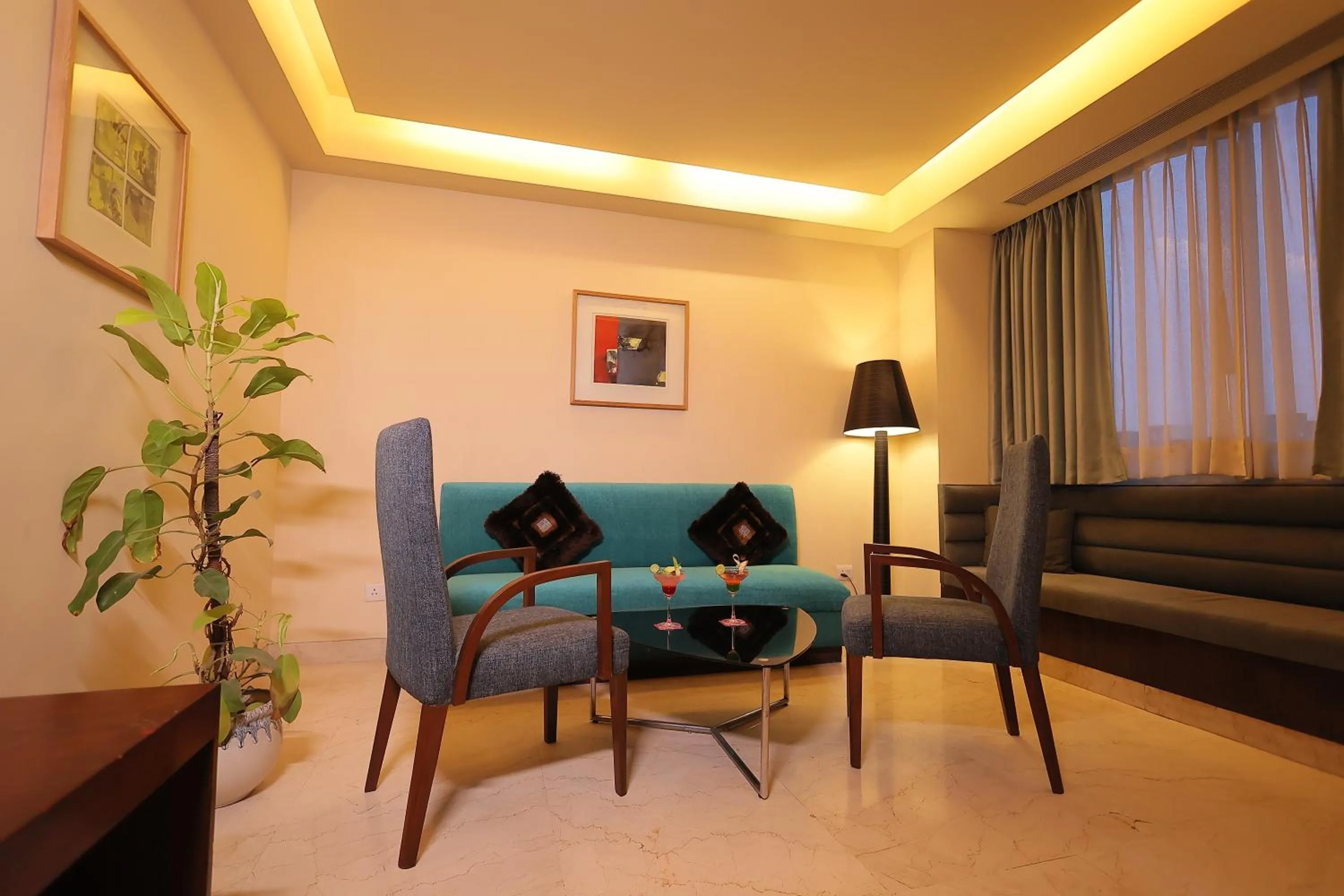 Living room in Regenta Orkos Kolkata by Royal Orchid Hotels Limited