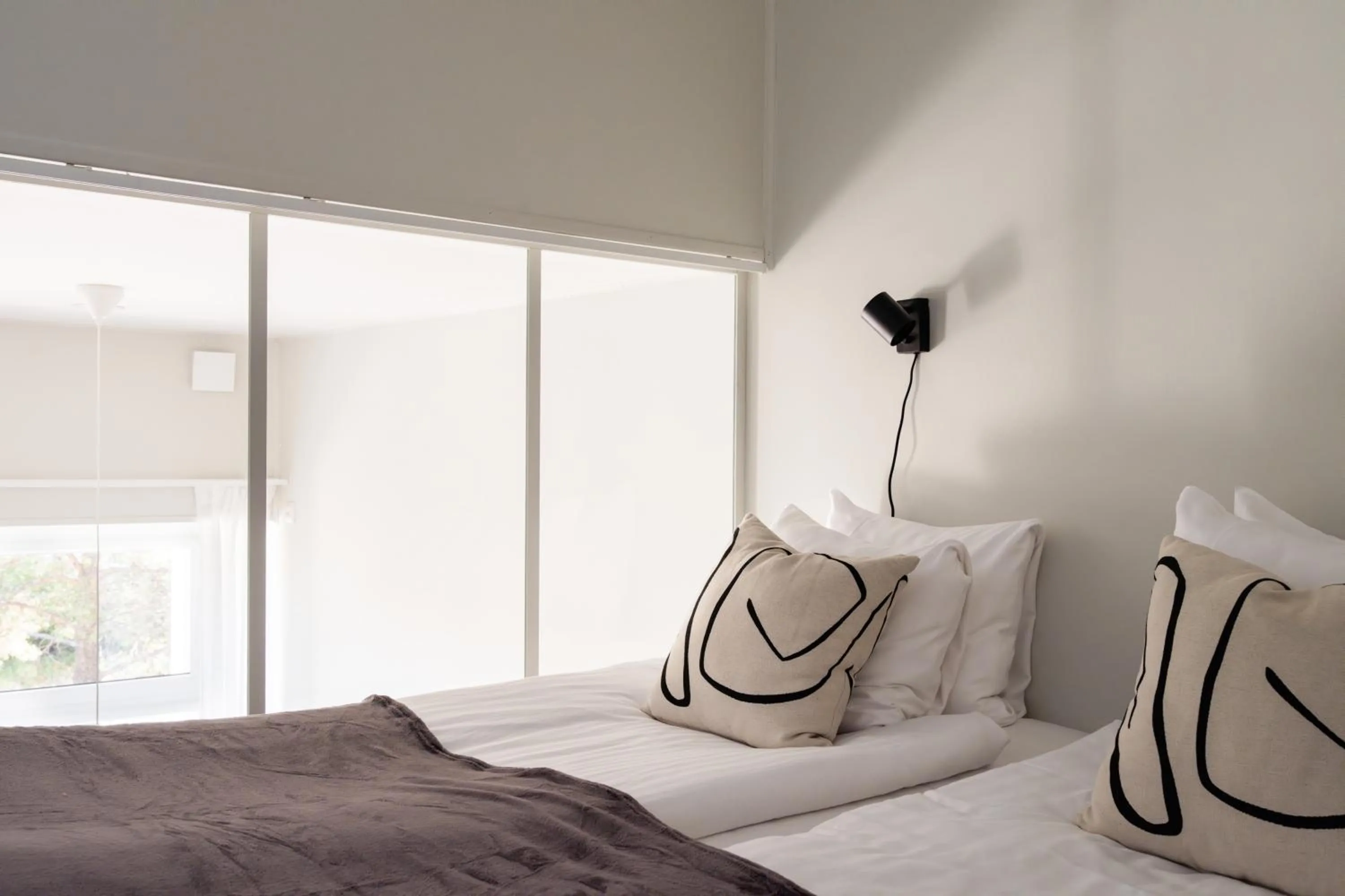 Bed in Waterfront Cabins