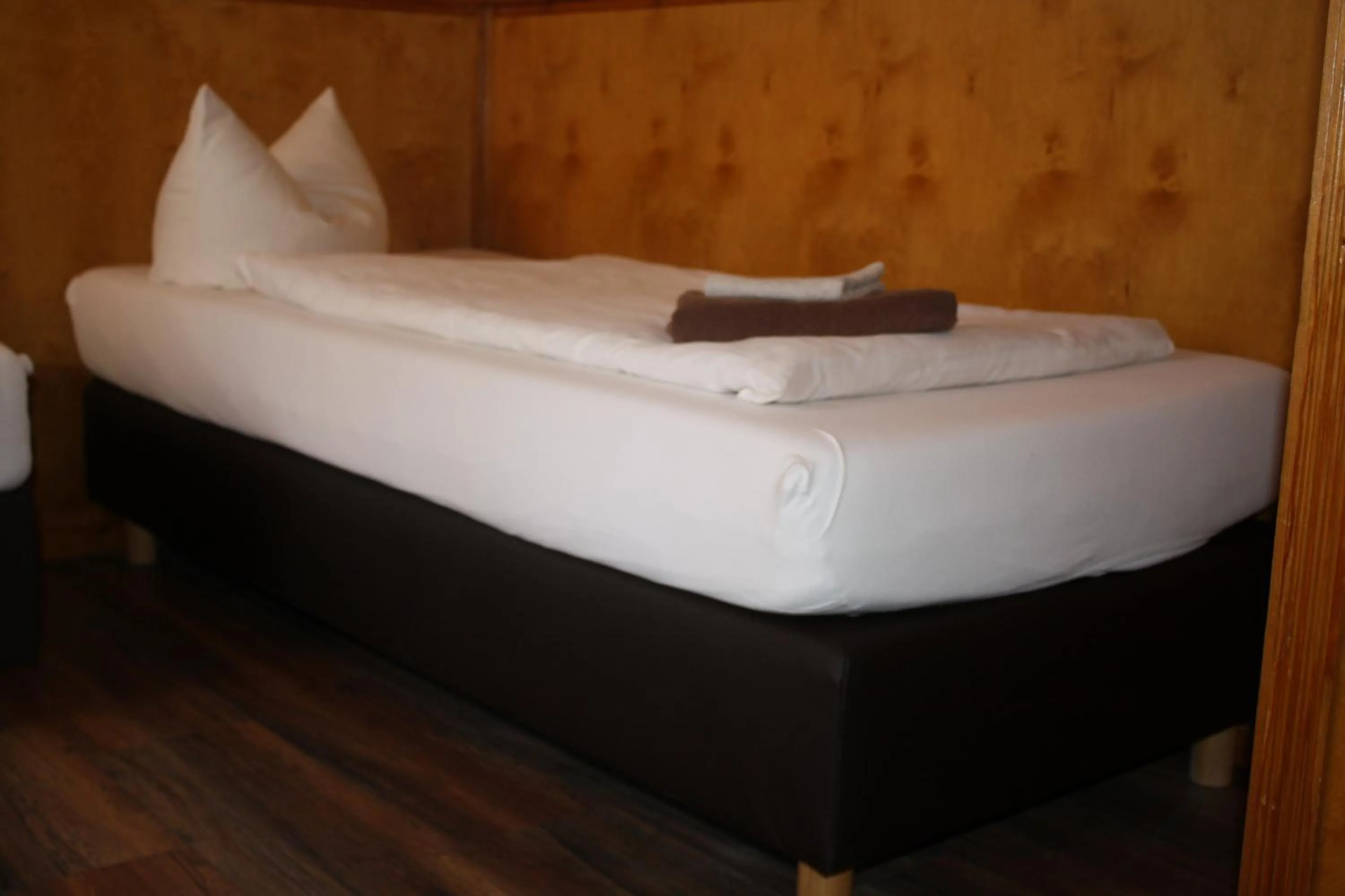 Bed in Pensionszimmer Unicat
