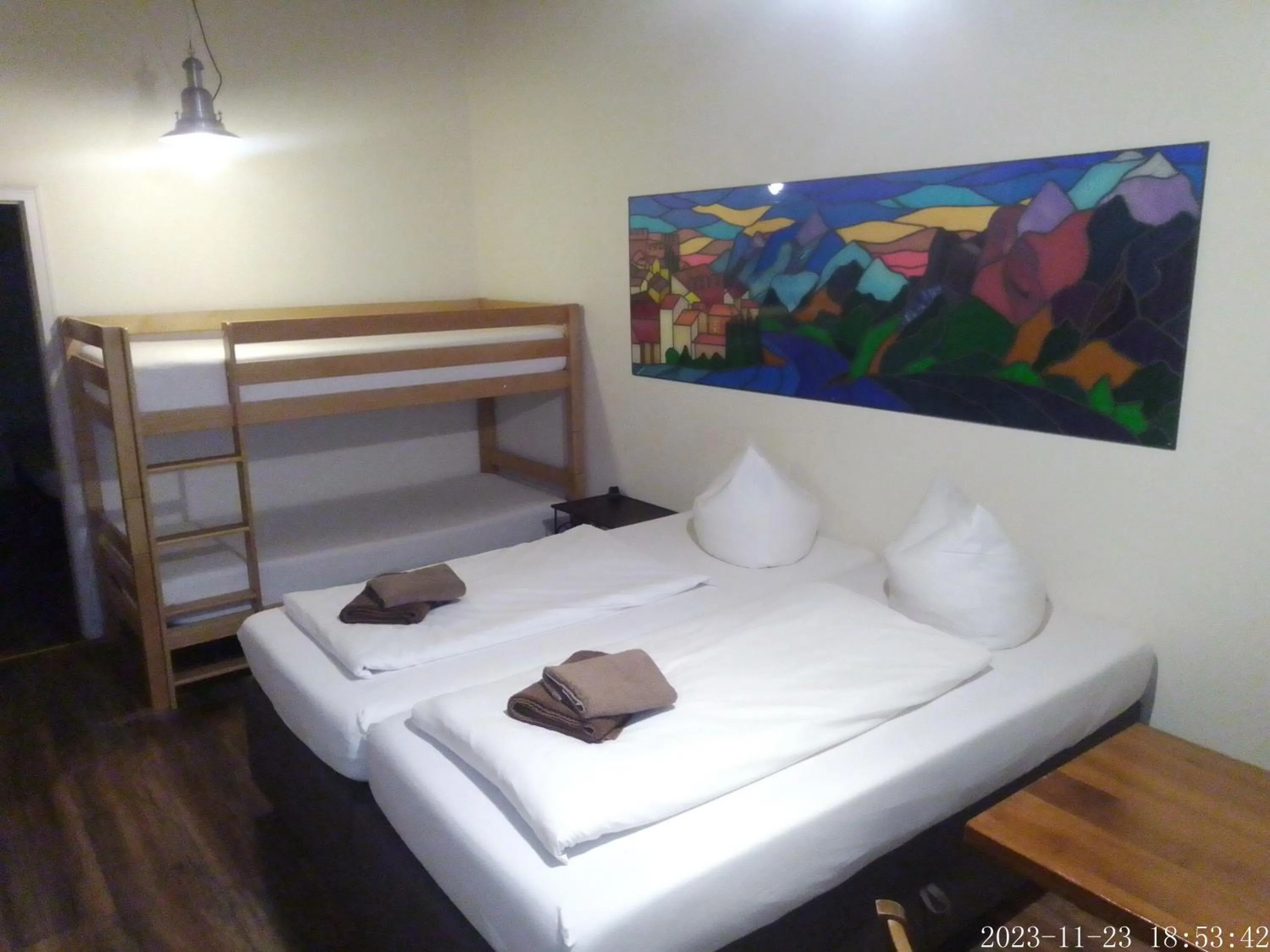 Bed in Pensionszimmer Unicat