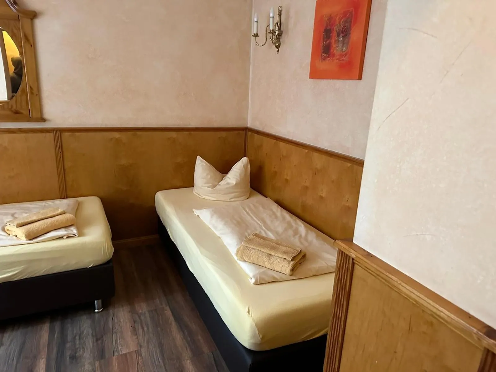 Bed in Pensionszimmer Unicat