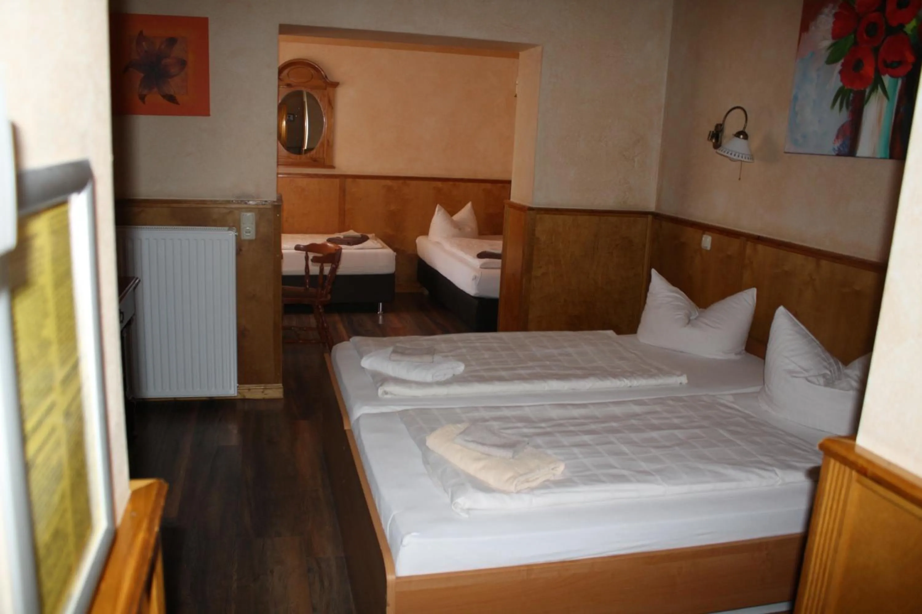 Bed in Pensionszimmer Unicat