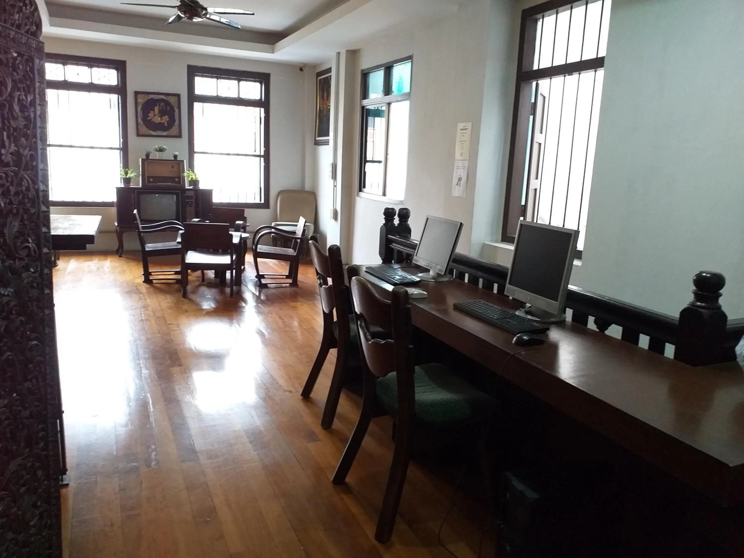 Communal lounge/ TV room in Phuket Sunny Hostel