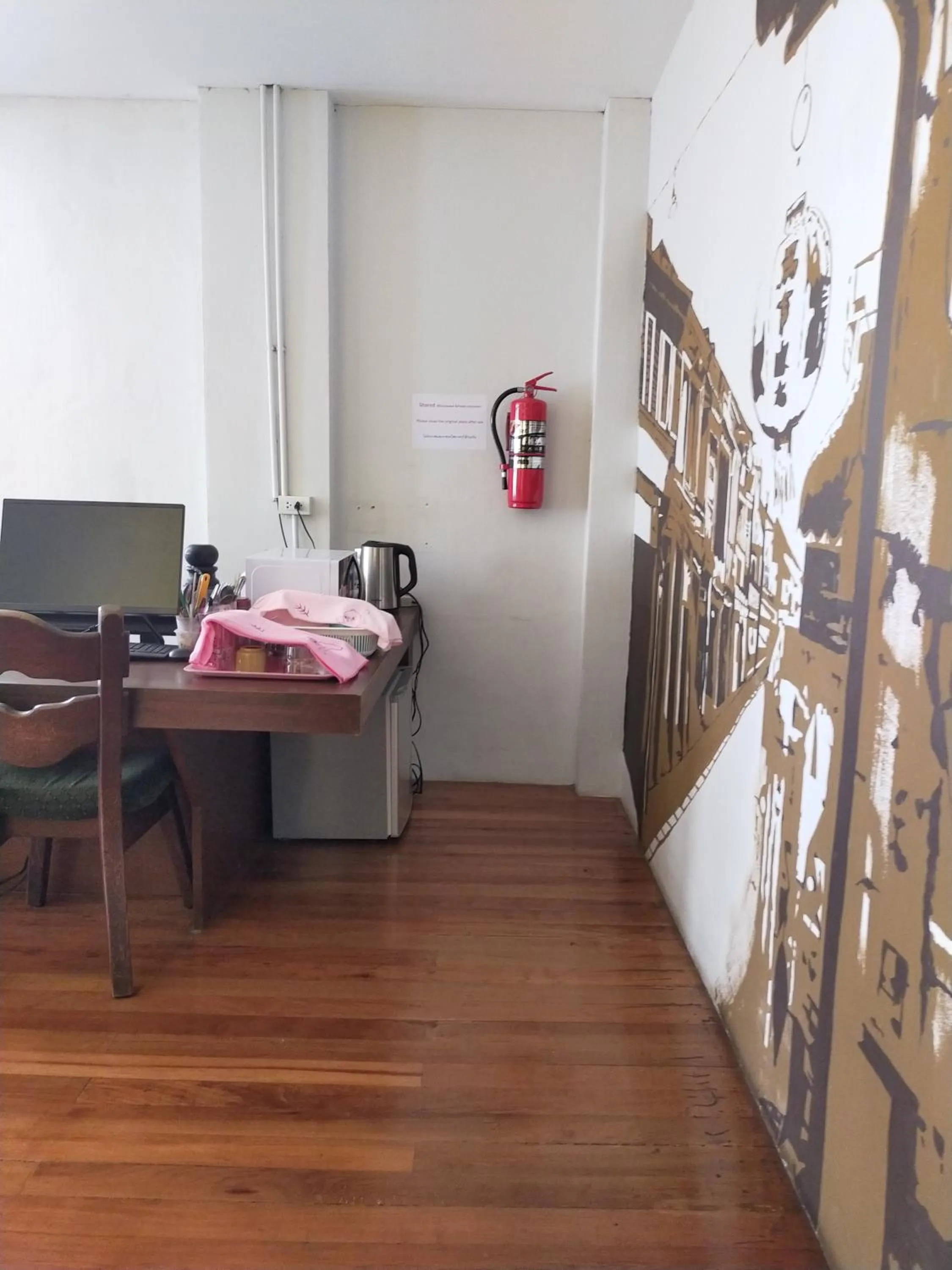 Communal lounge/ TV room in Phuket Sunny Hostel