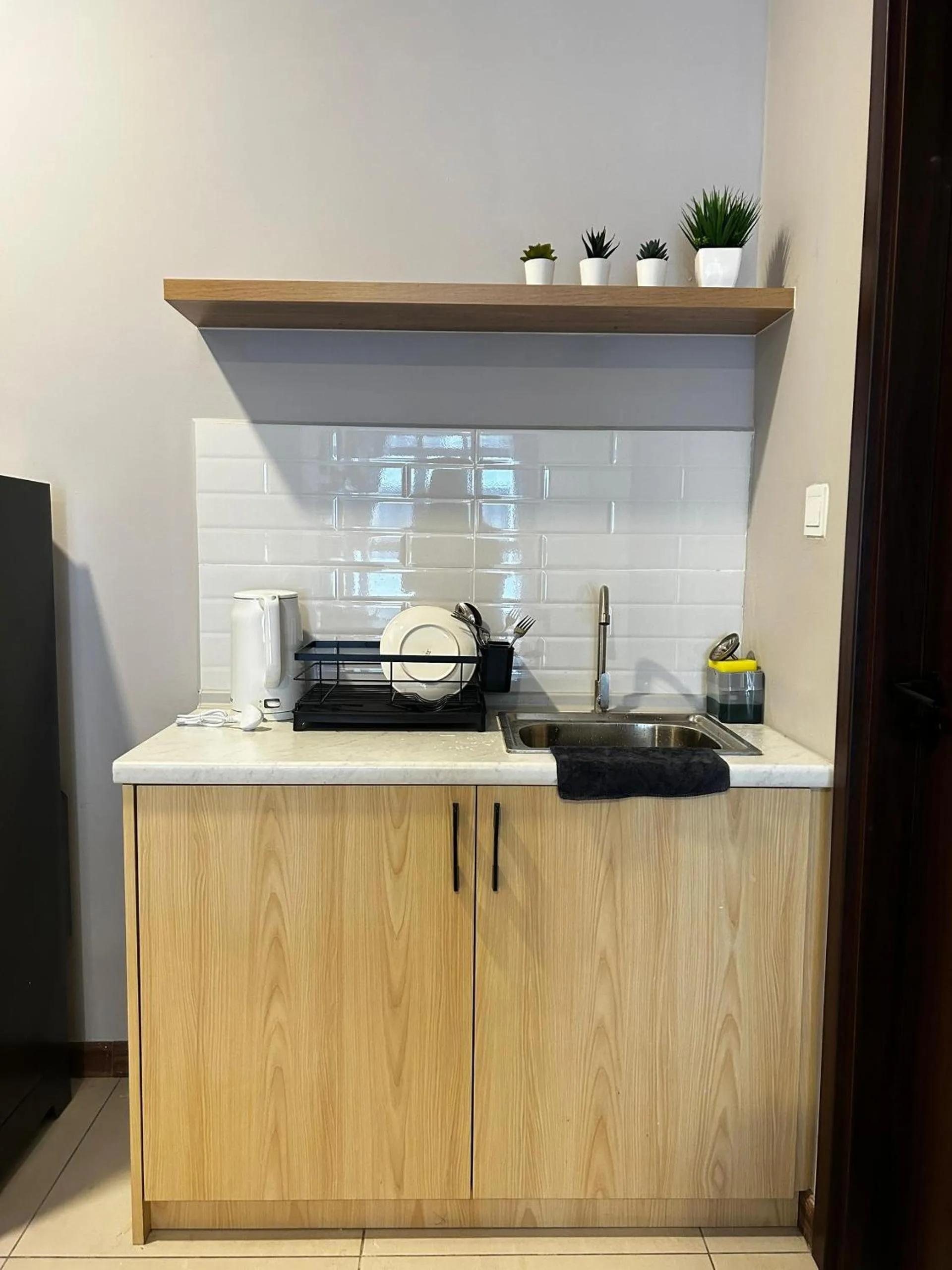 Kitchen or kitchenette in K Avenue by Pinstay