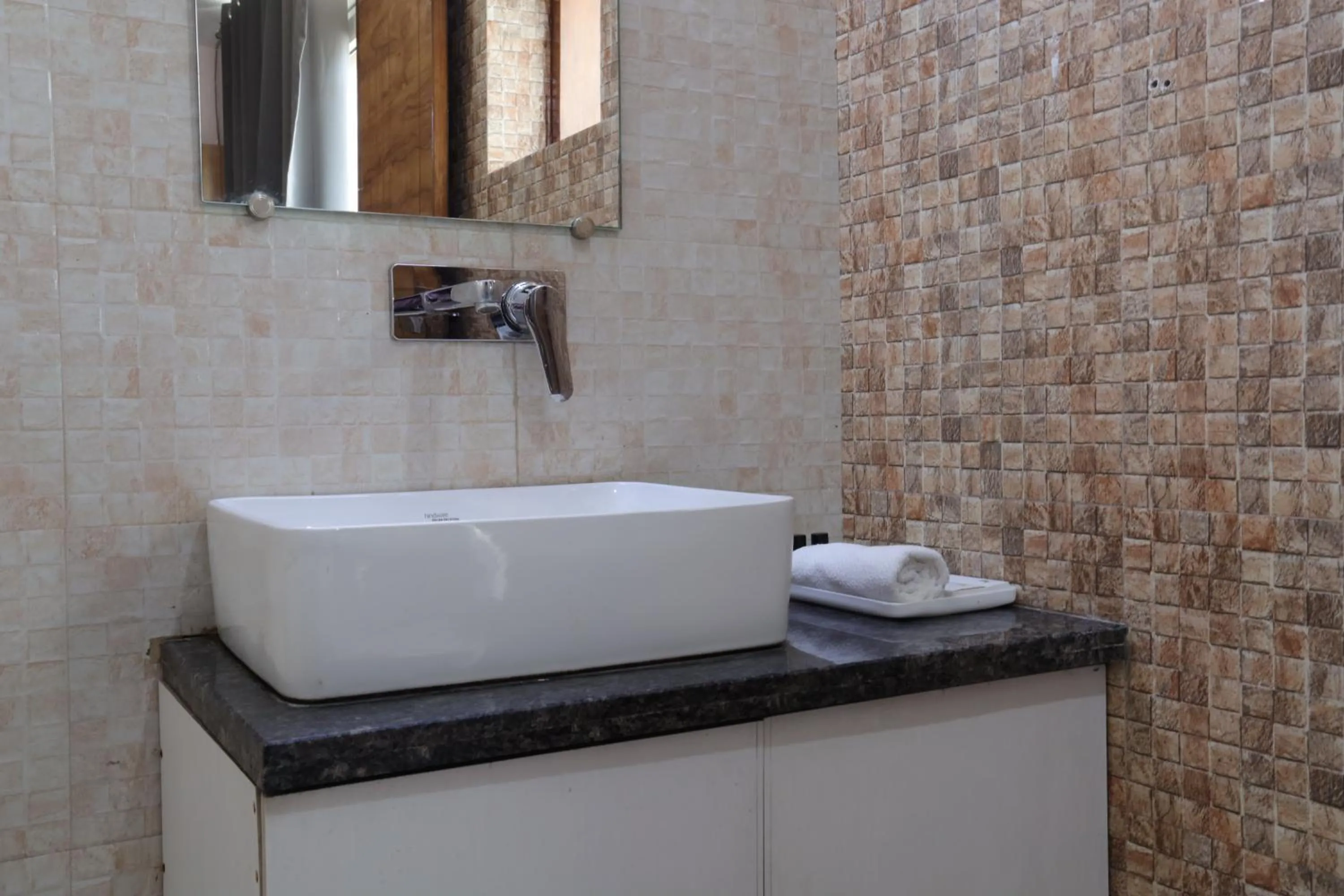 Bathroom in The Sandalwood Hotel I Sec-38 I Near Medanta Medicity Gurgaon