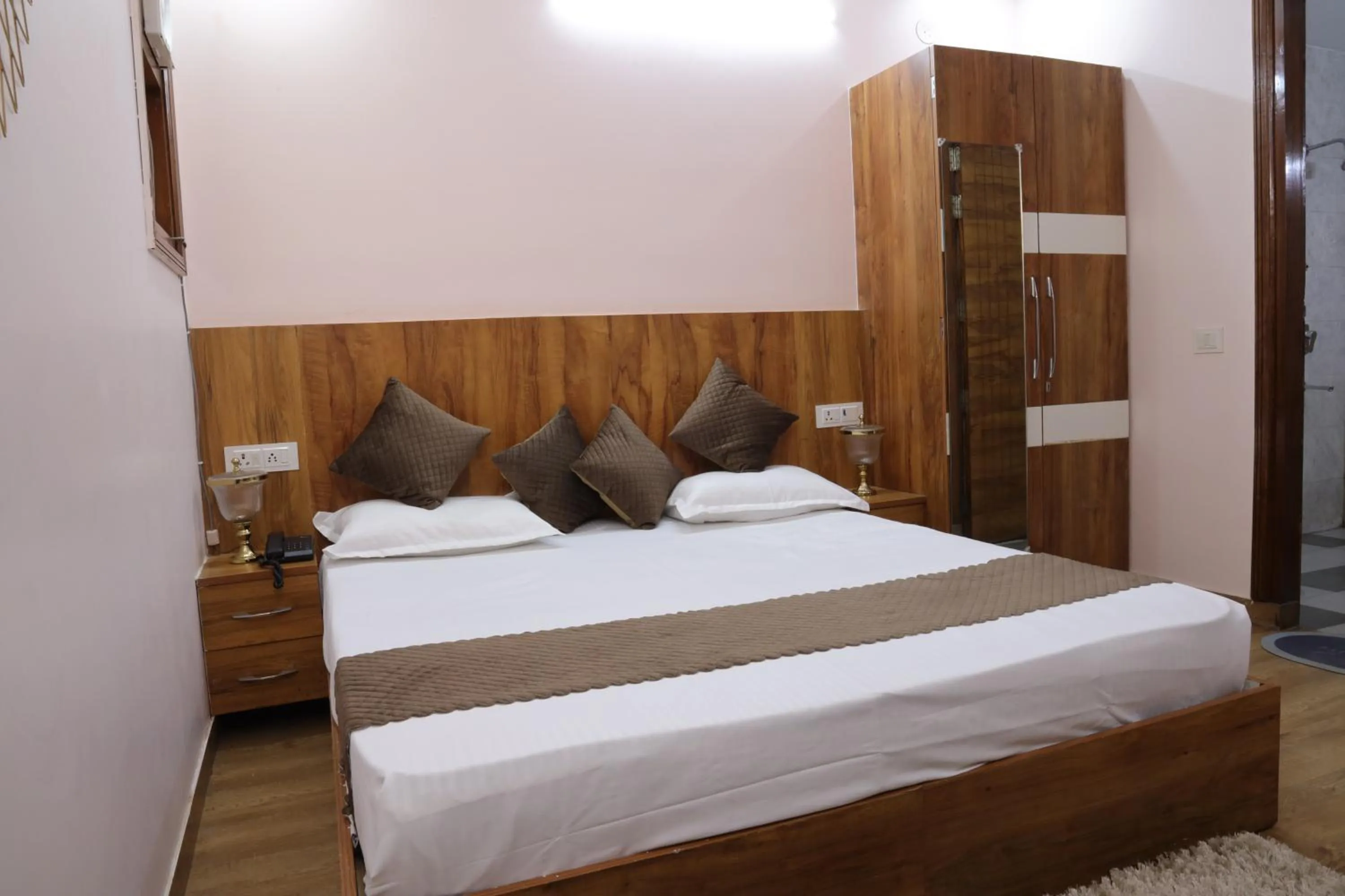 Bed in The Sandalwood Hotel I Sec-38 I Near Medanta Medicity Gurgaon