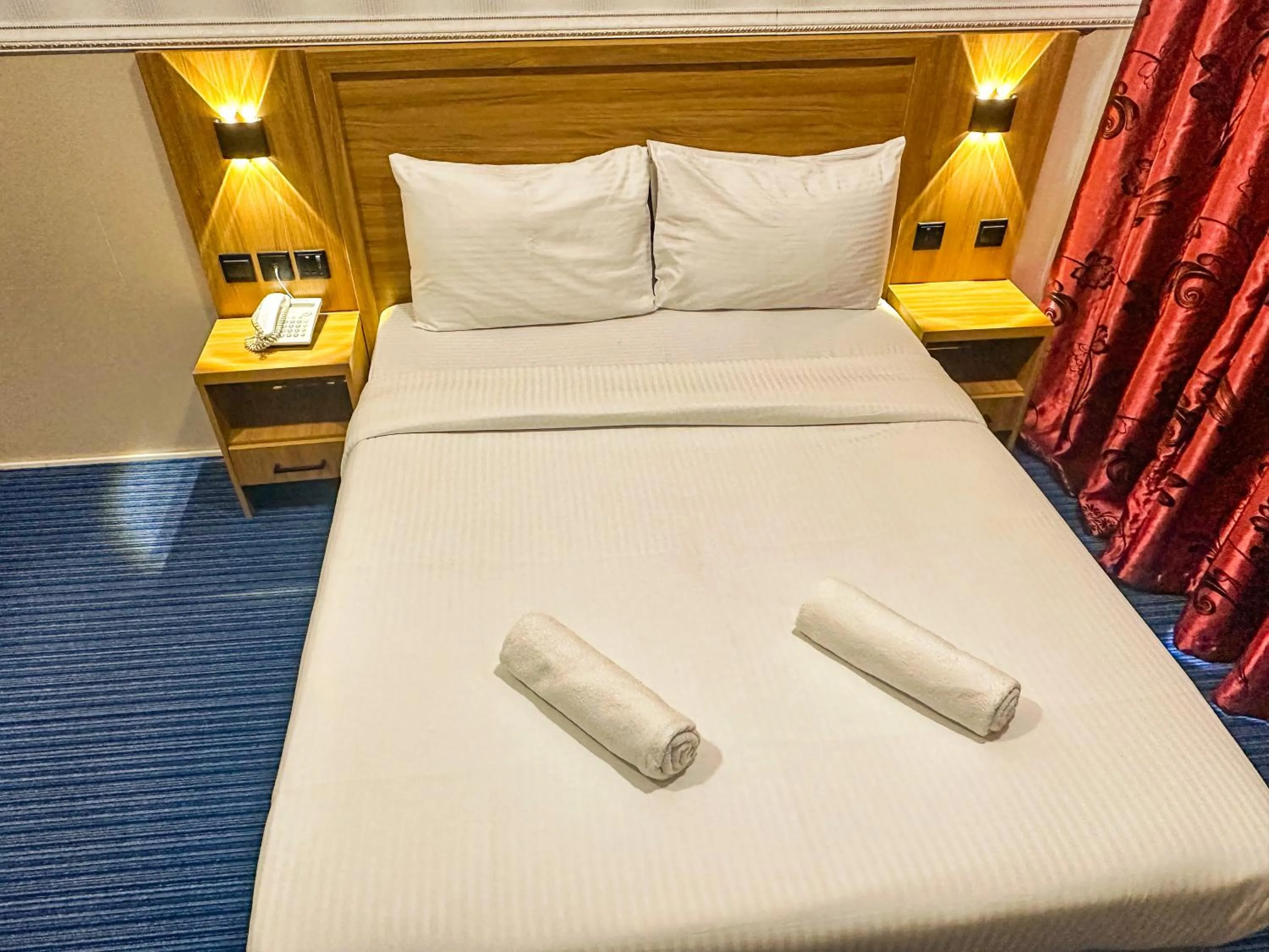 Bed in TAMARIND HOTEL