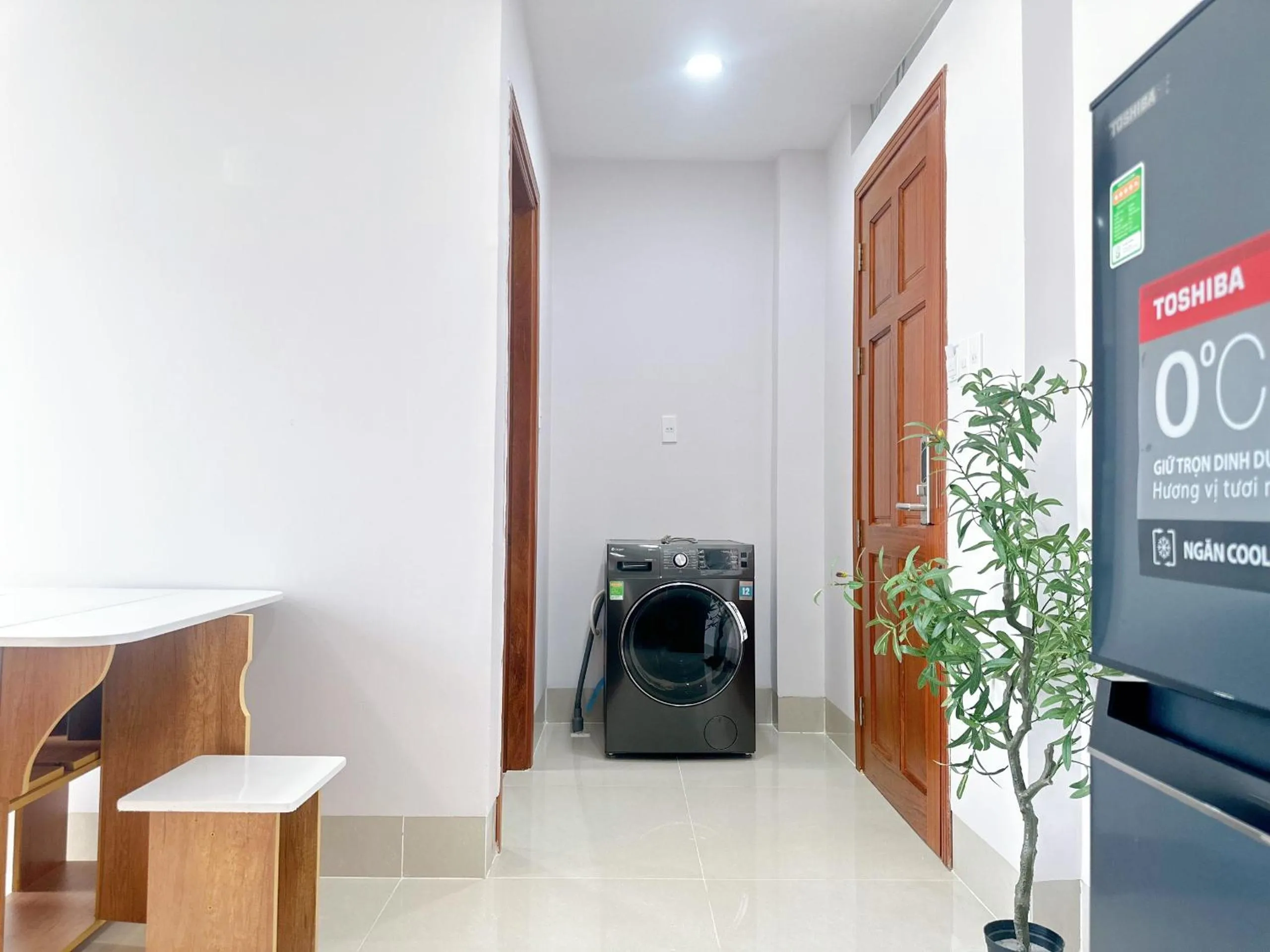 washing machine in Milanesa Hotel and Apartment