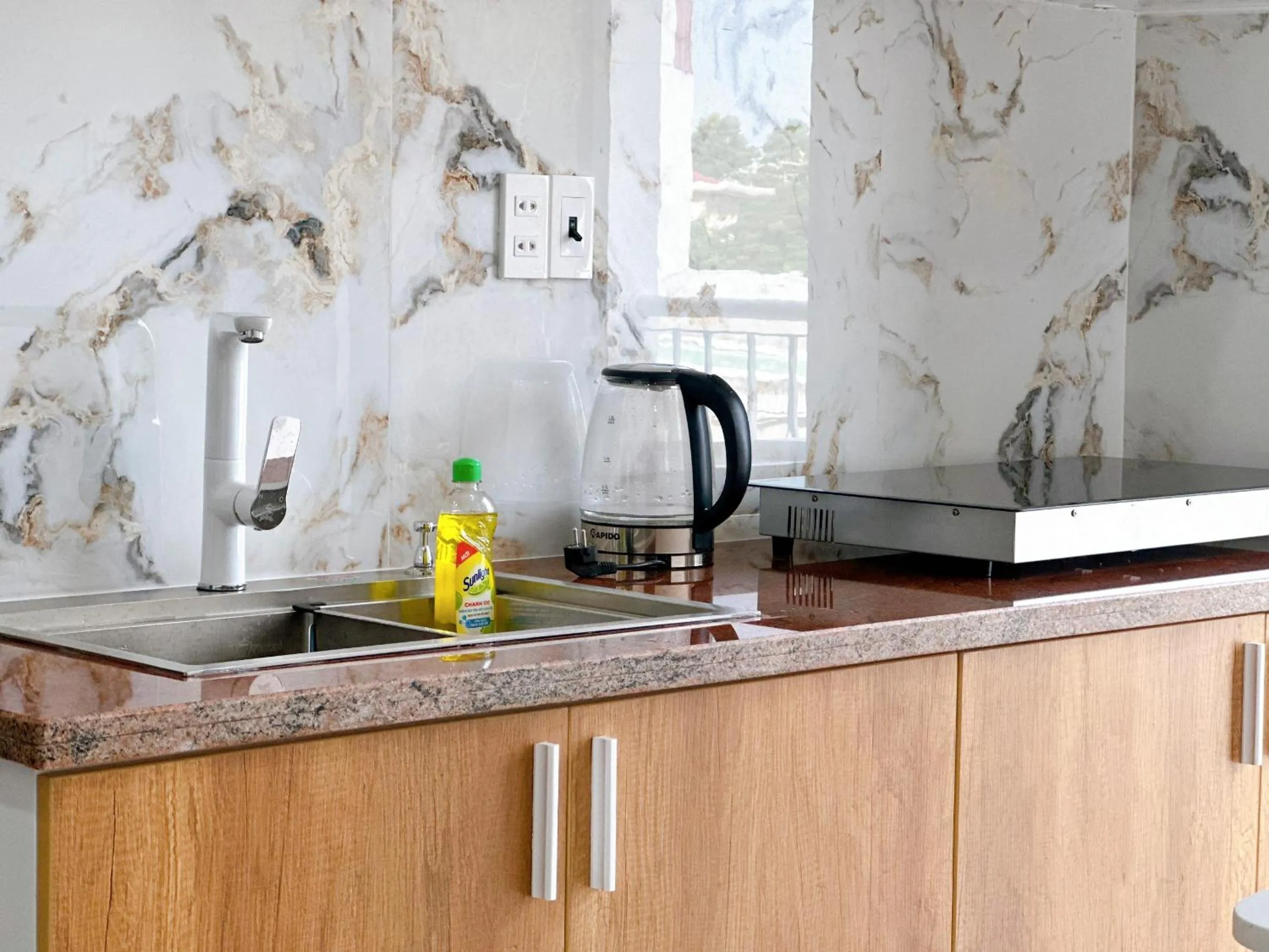 Kitchen or kitchenette in Milanesa Hotel and Apartment