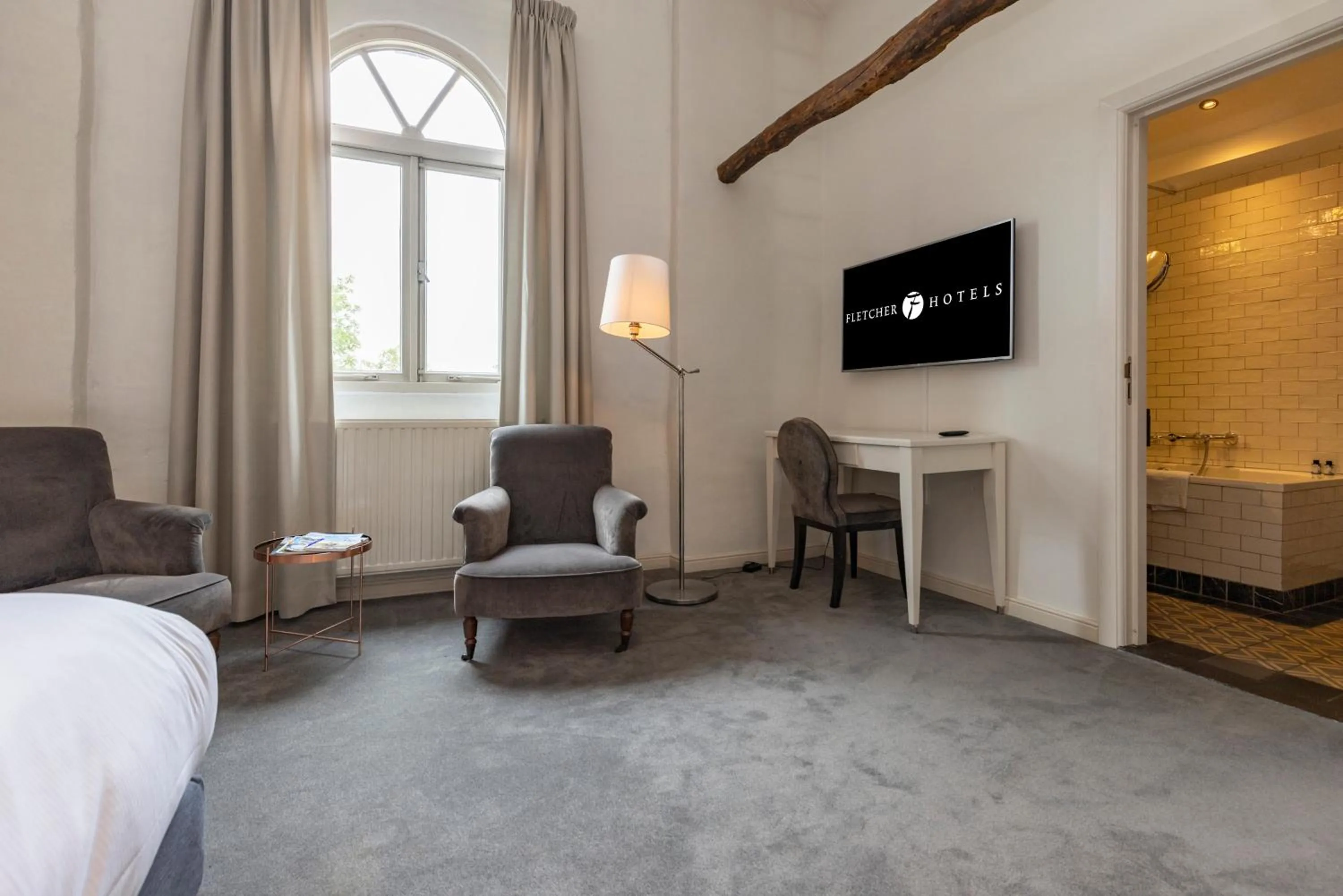 Seating area in Fletcher Hotel Château De Raay