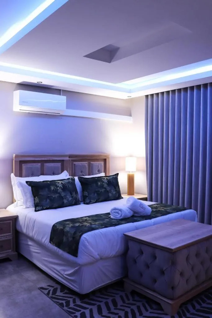 Bed in EDEN BOUTIQUE HOTEL