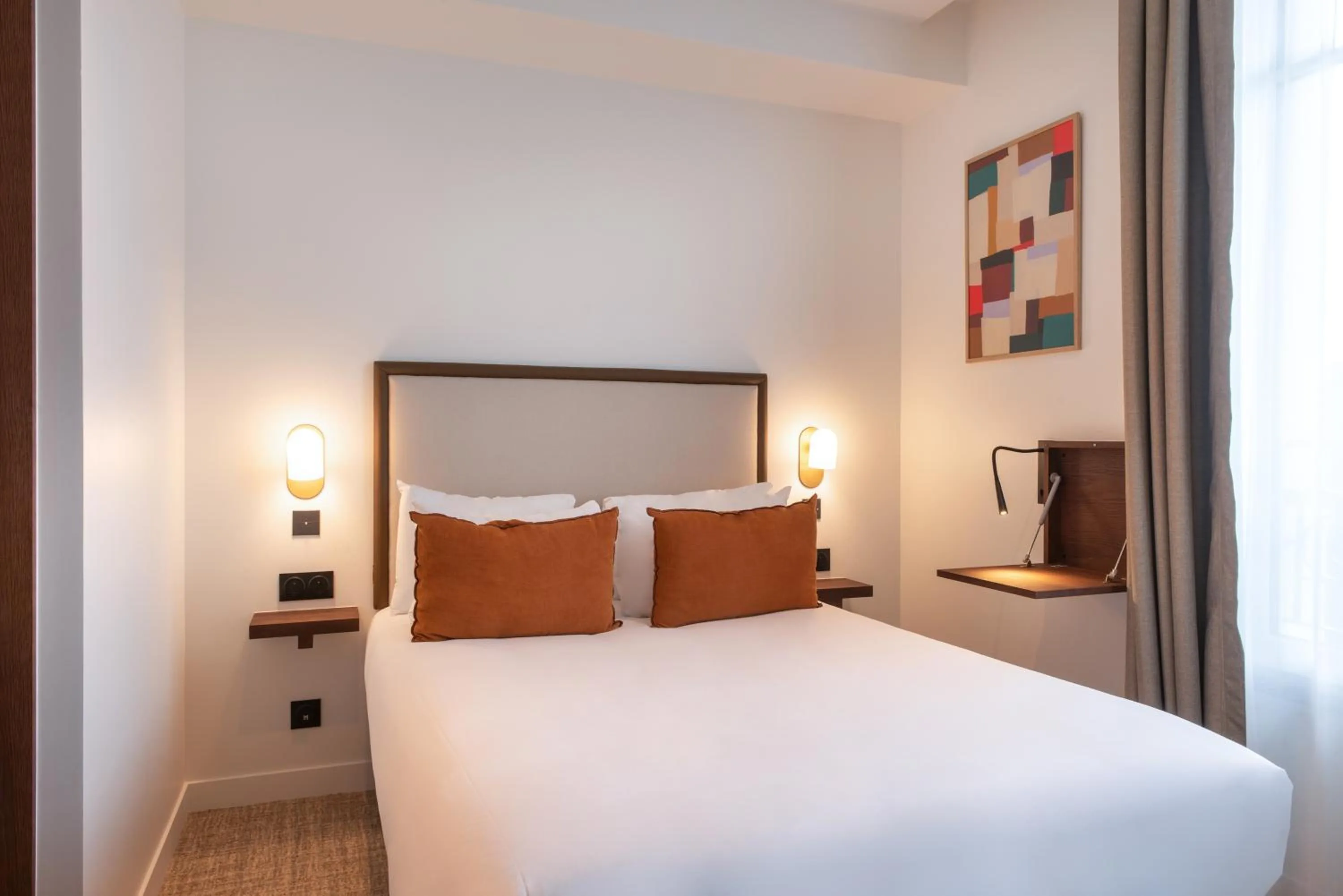 Bed in Le Lampika Hôtel