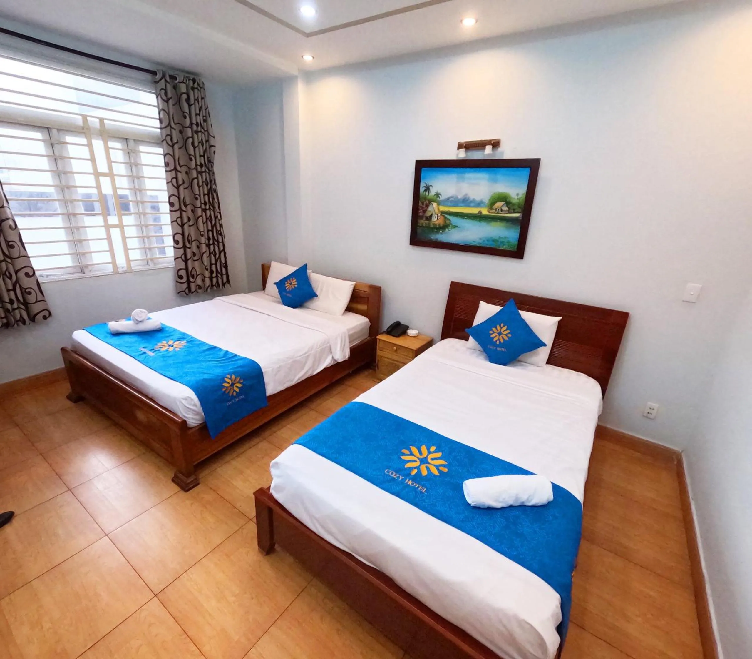 Bed in COZY Hotel HCM