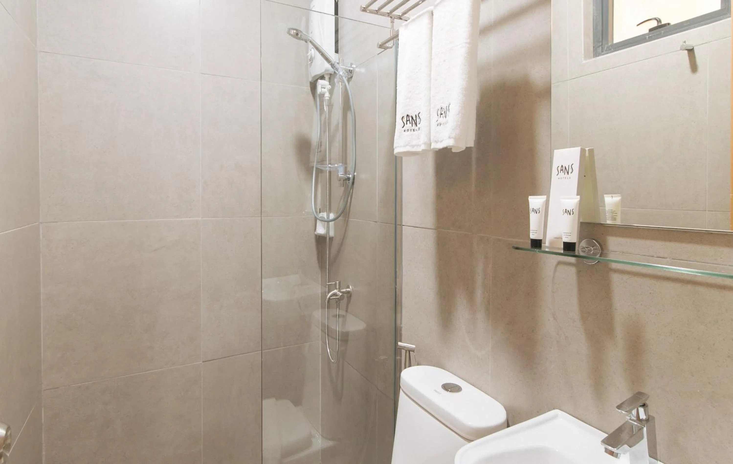 Shower in Sans Hotel at One JD Place Makati by RedDoorz