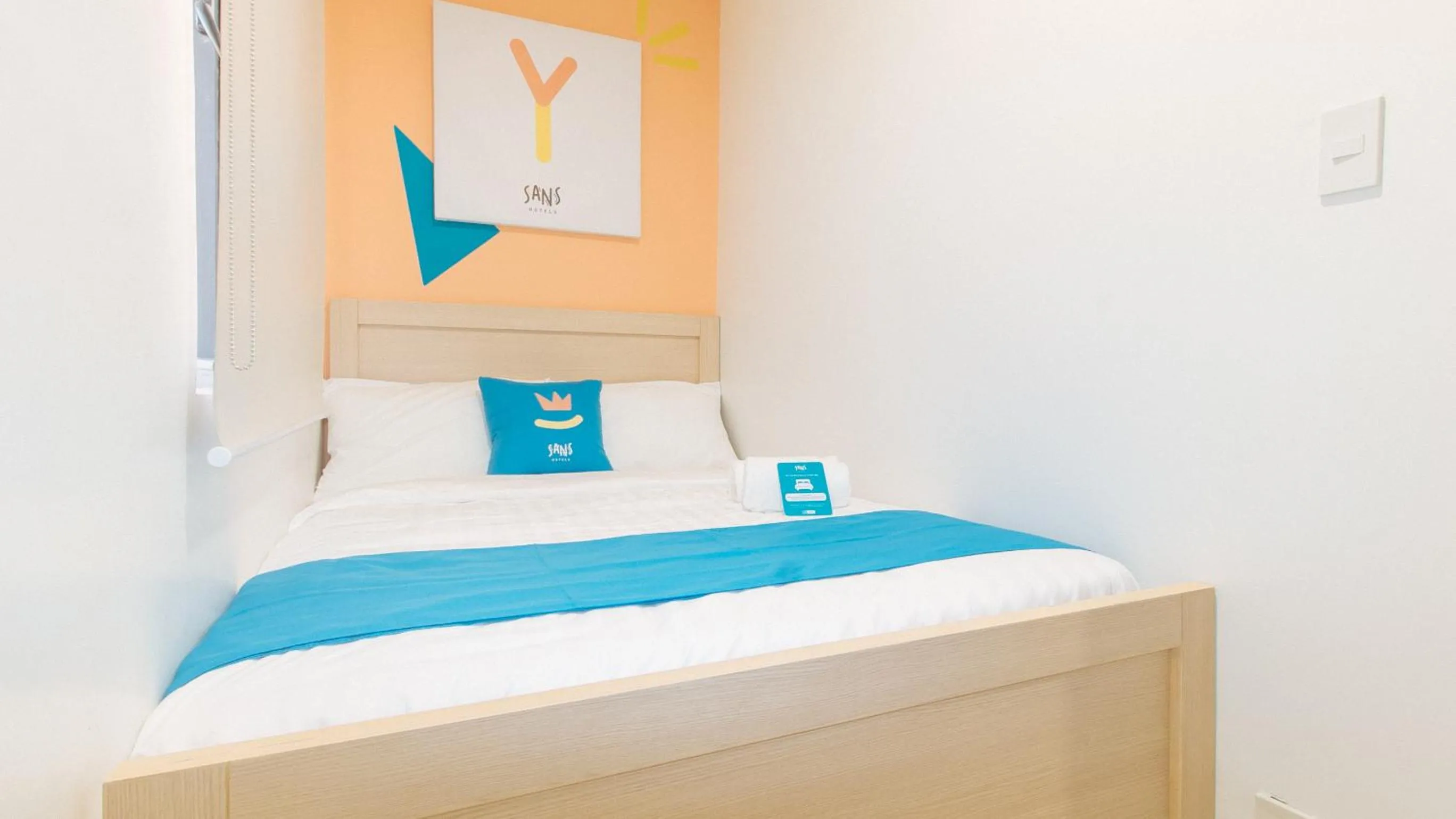 Photo of the whole room, Bed in Sans Hotel at One JD Place Makati by RedDoorz