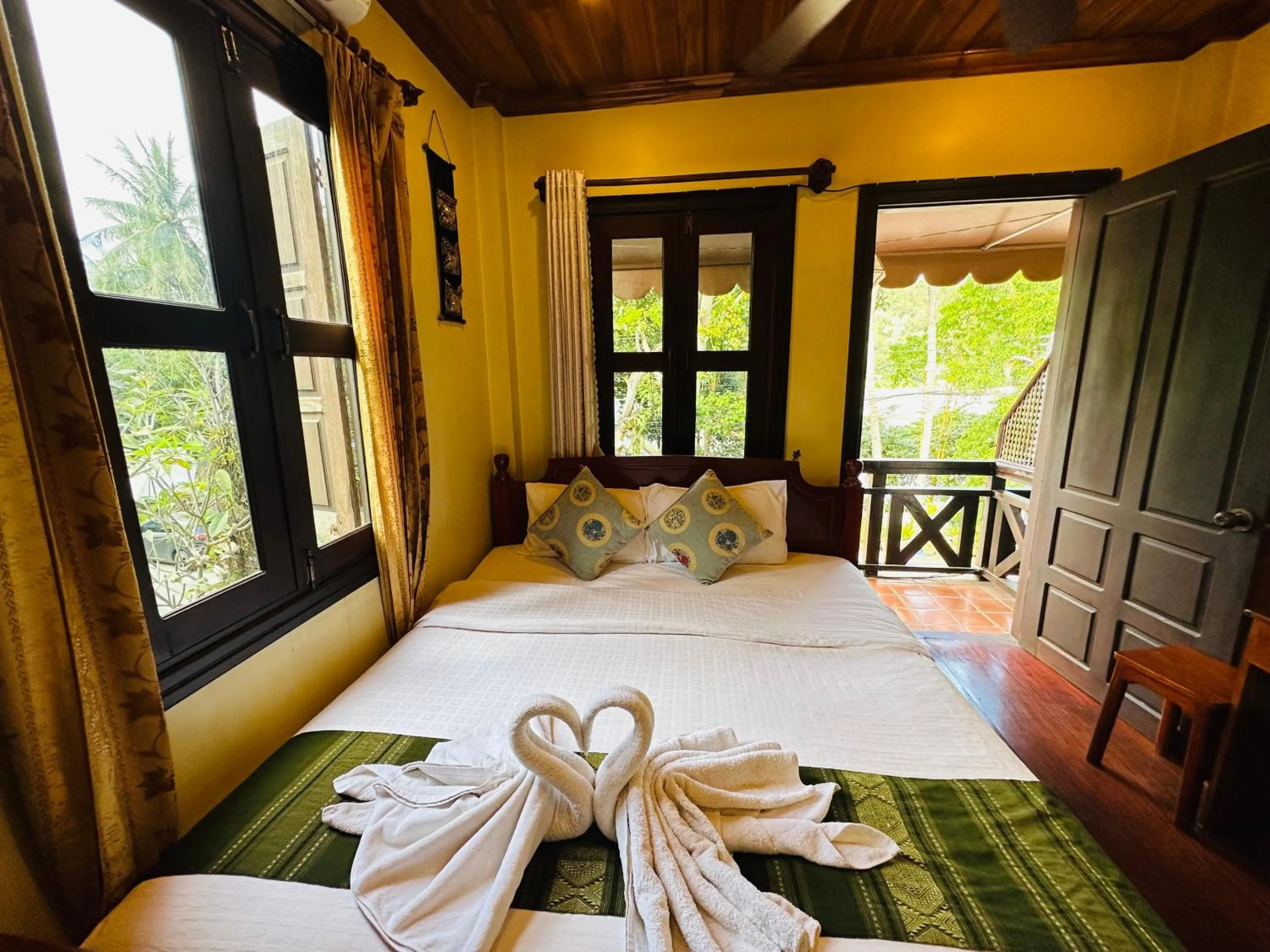 Bed in Anisa Mekong Riverside Villa