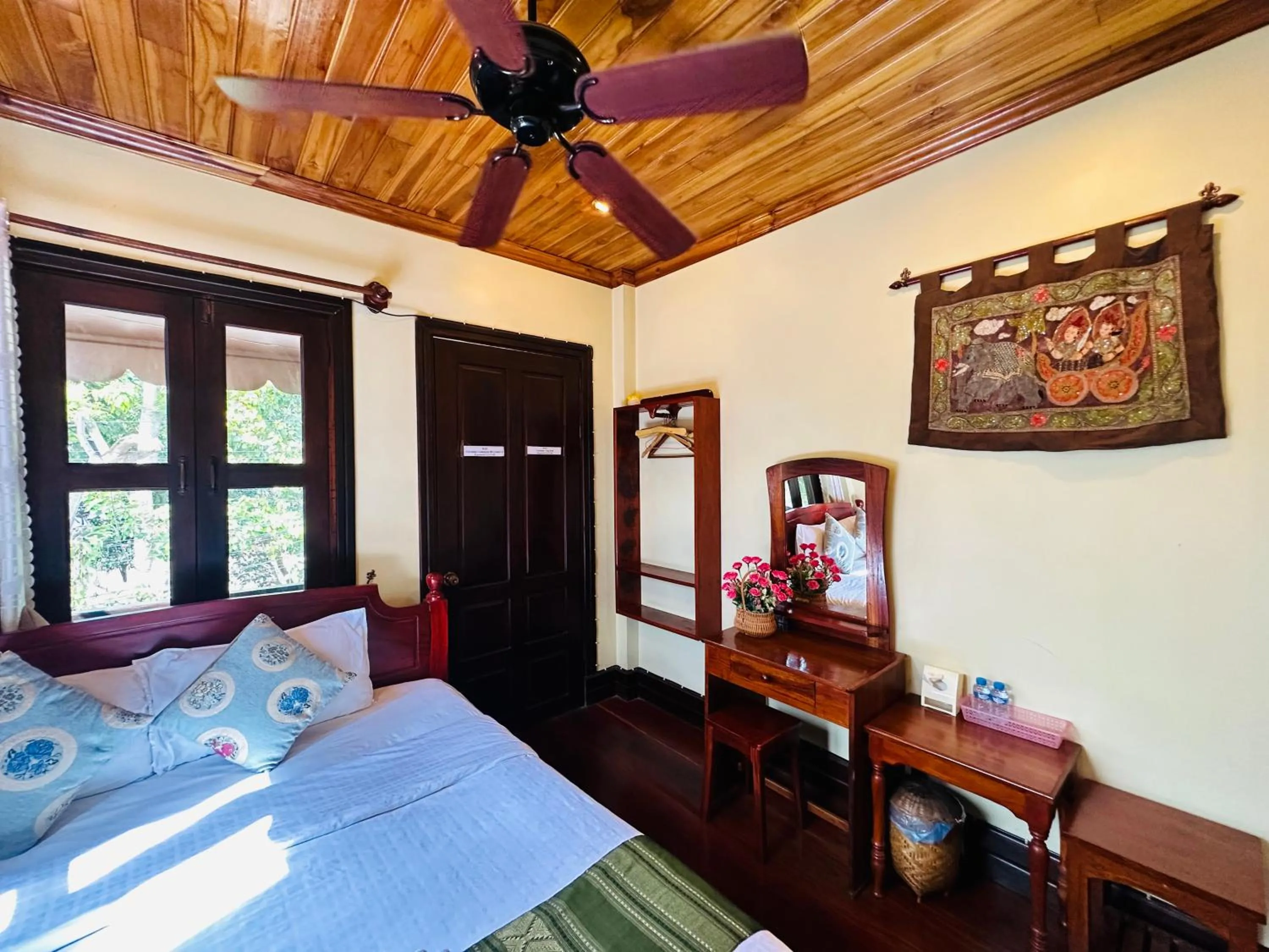 Bed in Anisa Mekong Riverside Villa