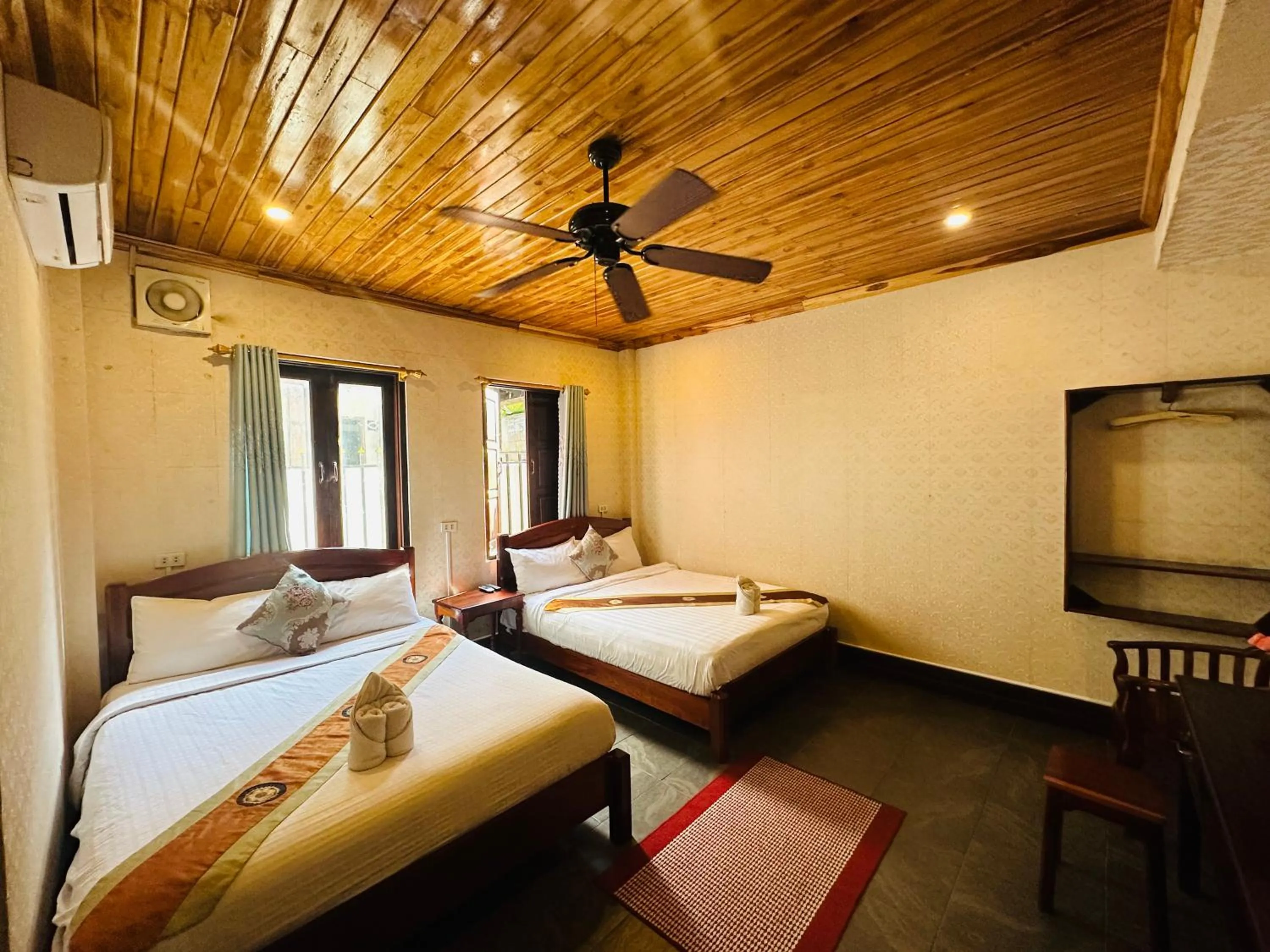 Bed in Anisa Mekong Riverside Villa