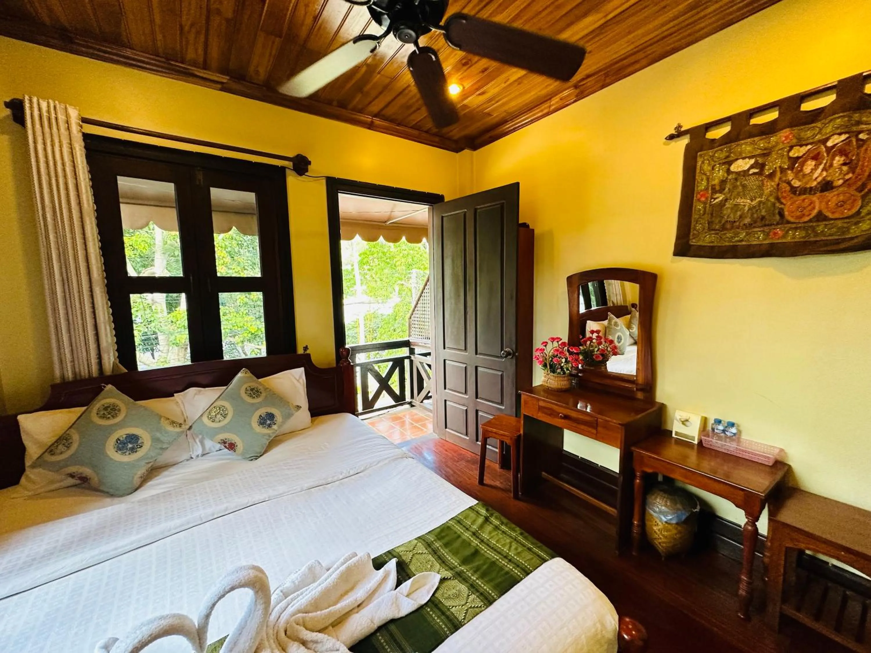 Bed in Anisa Mekong Riverside Villa