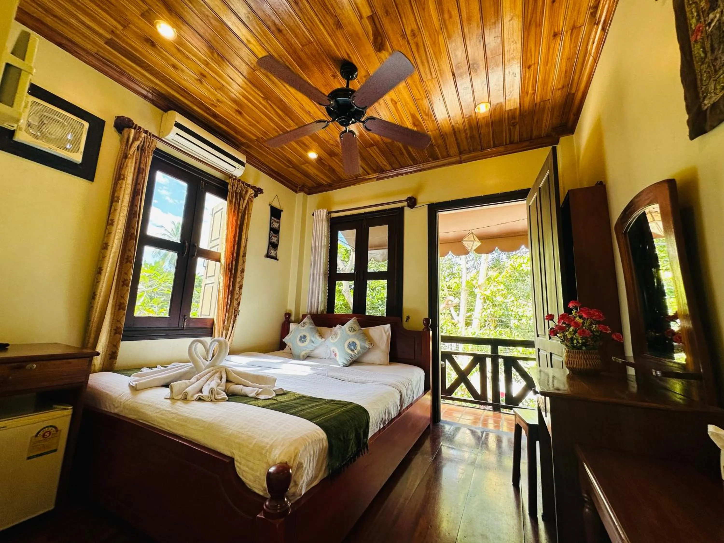 Bed in Anisa Mekong Riverside Villa