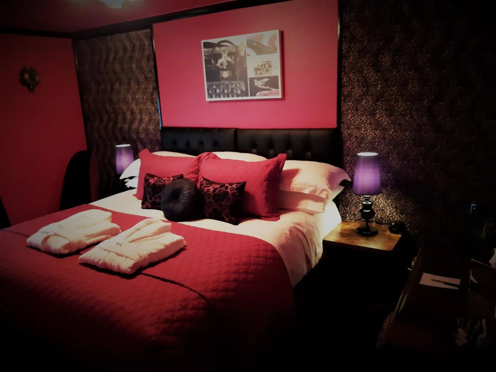 Bed in Cadillac Kustomz Guest House