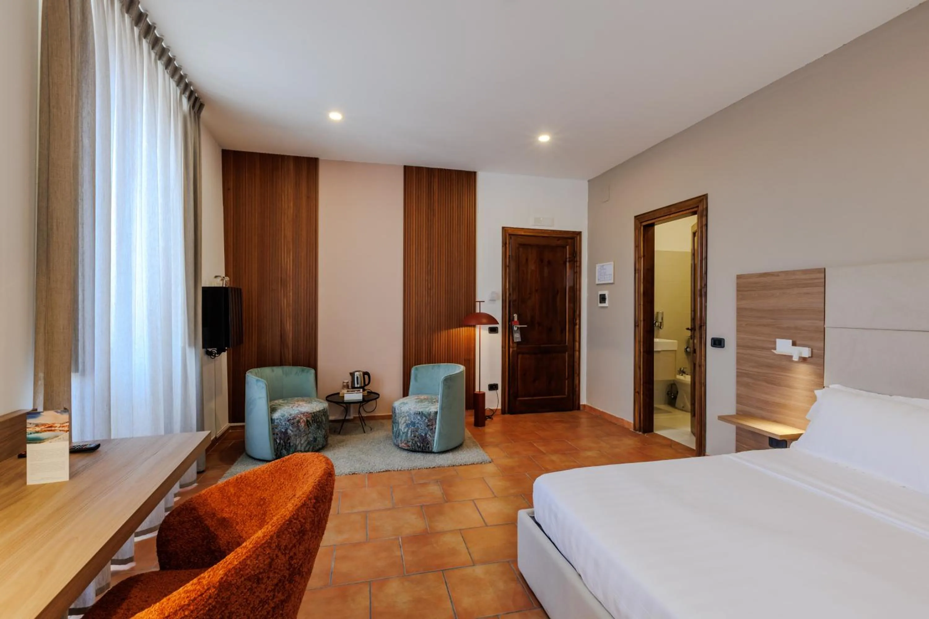 Communal lounge/ TV room, Bed in Palazzo della Città