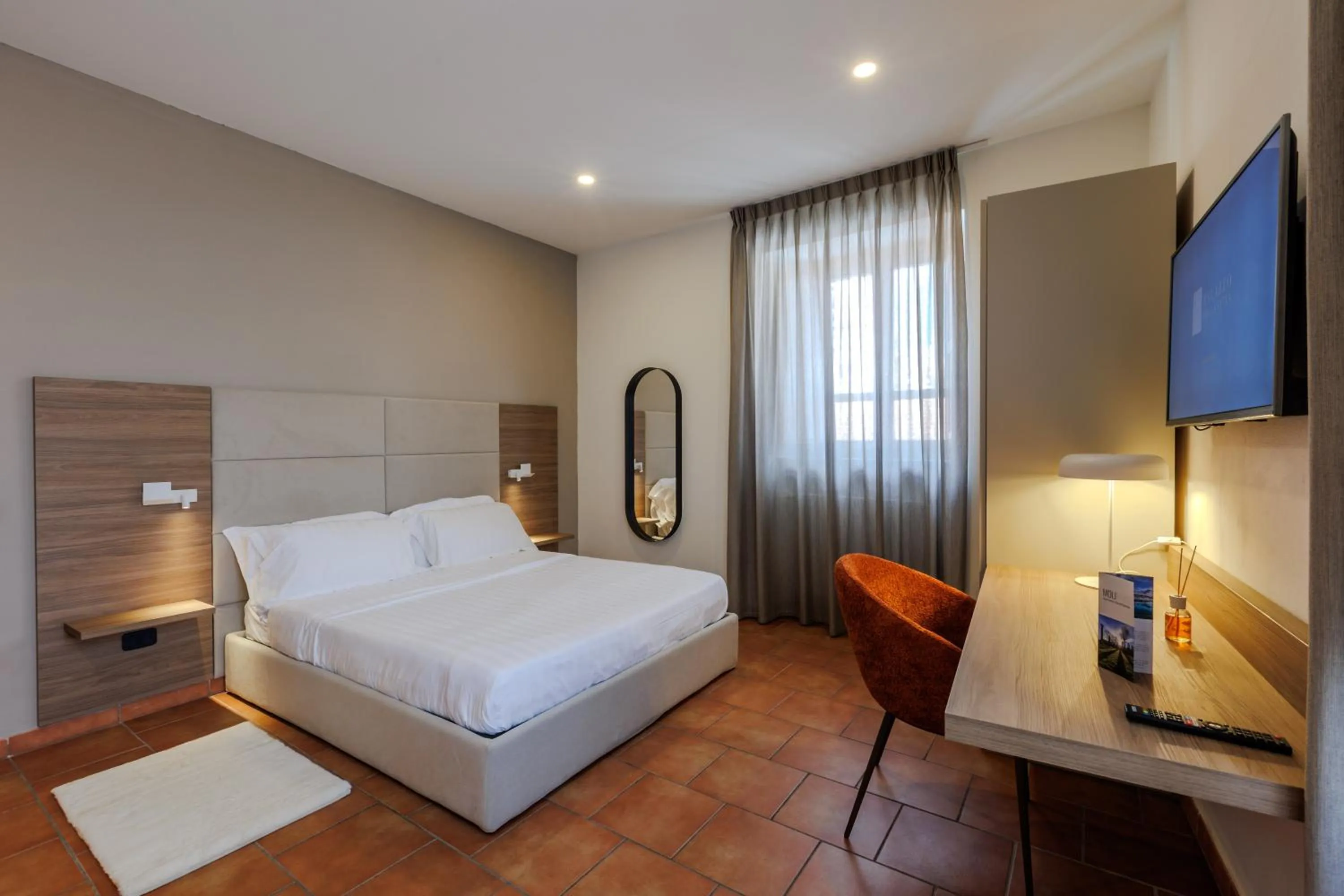 Communal lounge/ TV room, Bed in Palazzo della Città