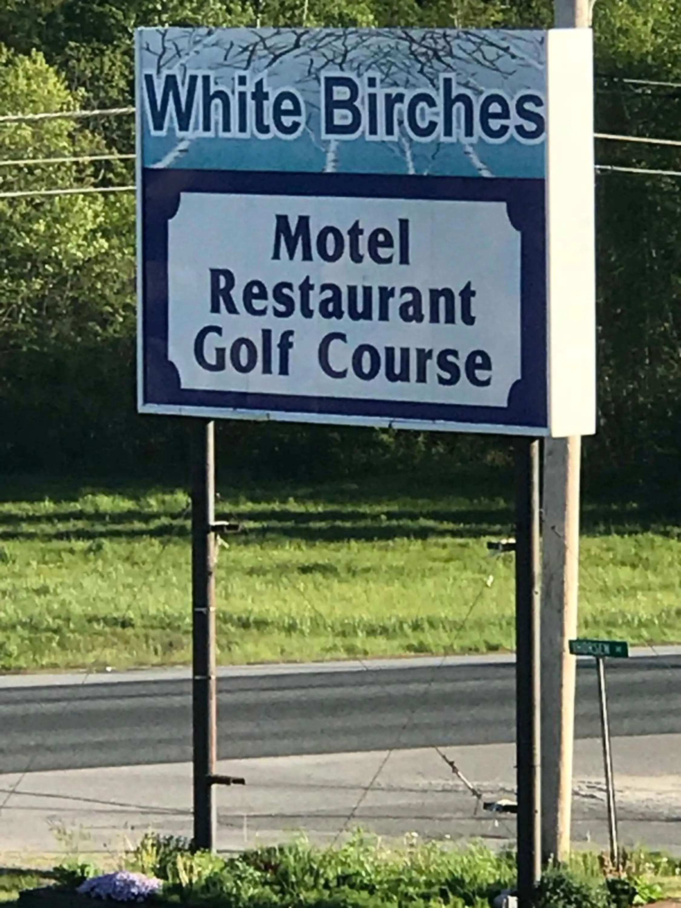 Property logo or sign in White Birches Motel