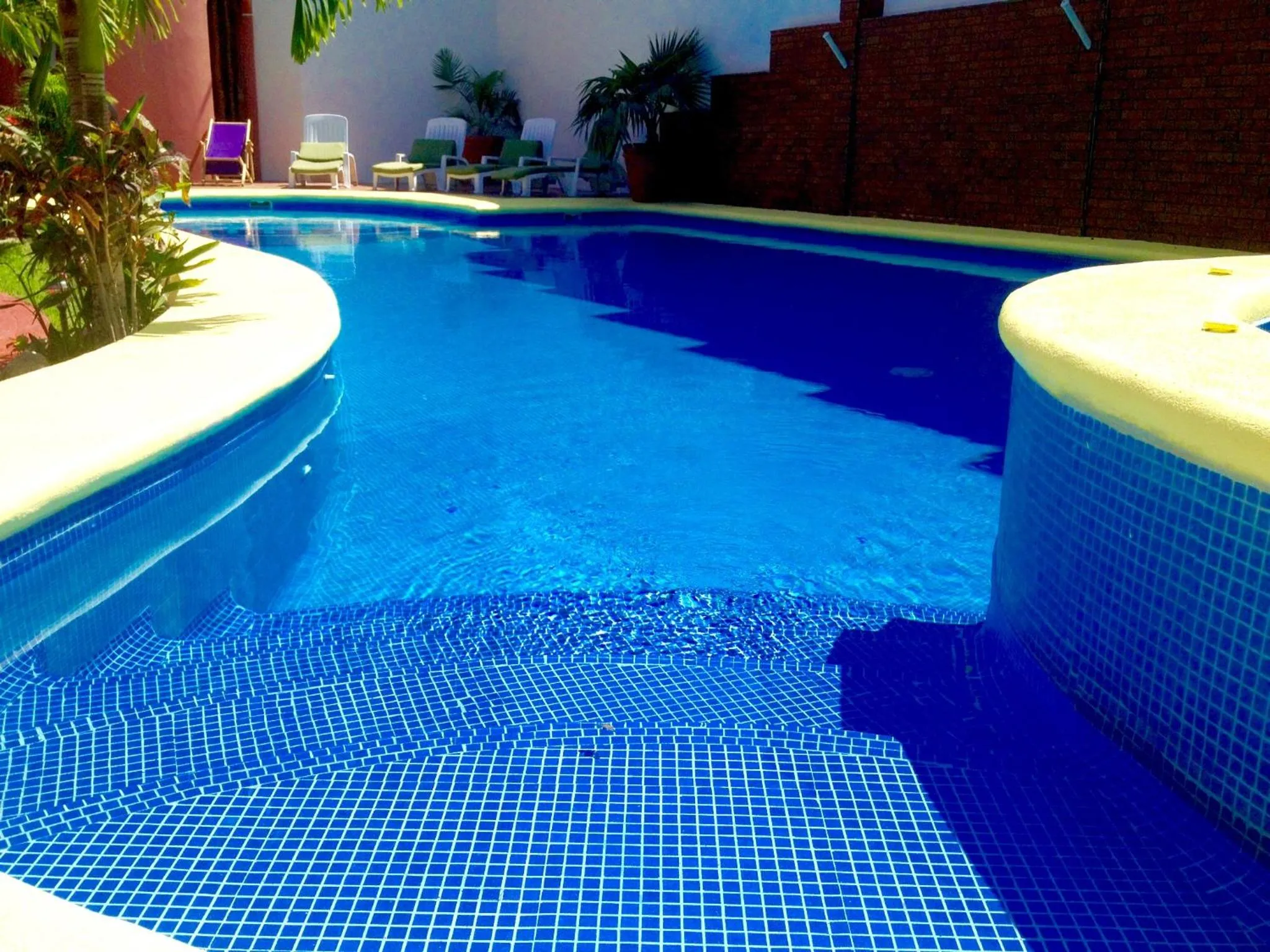 Swimming pool in Hotel y Suites Los Encantos