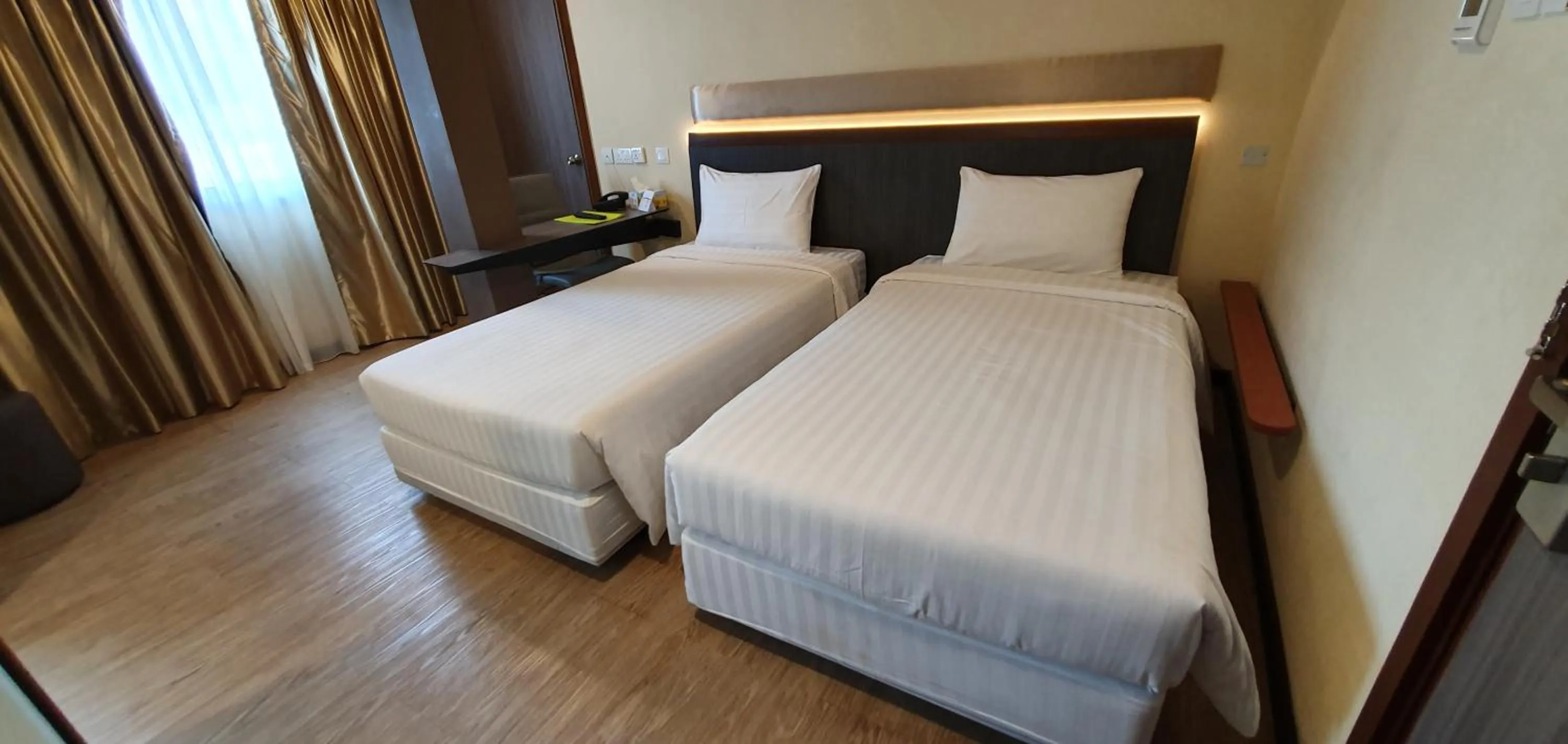 Bed in The Capital Residence Suites