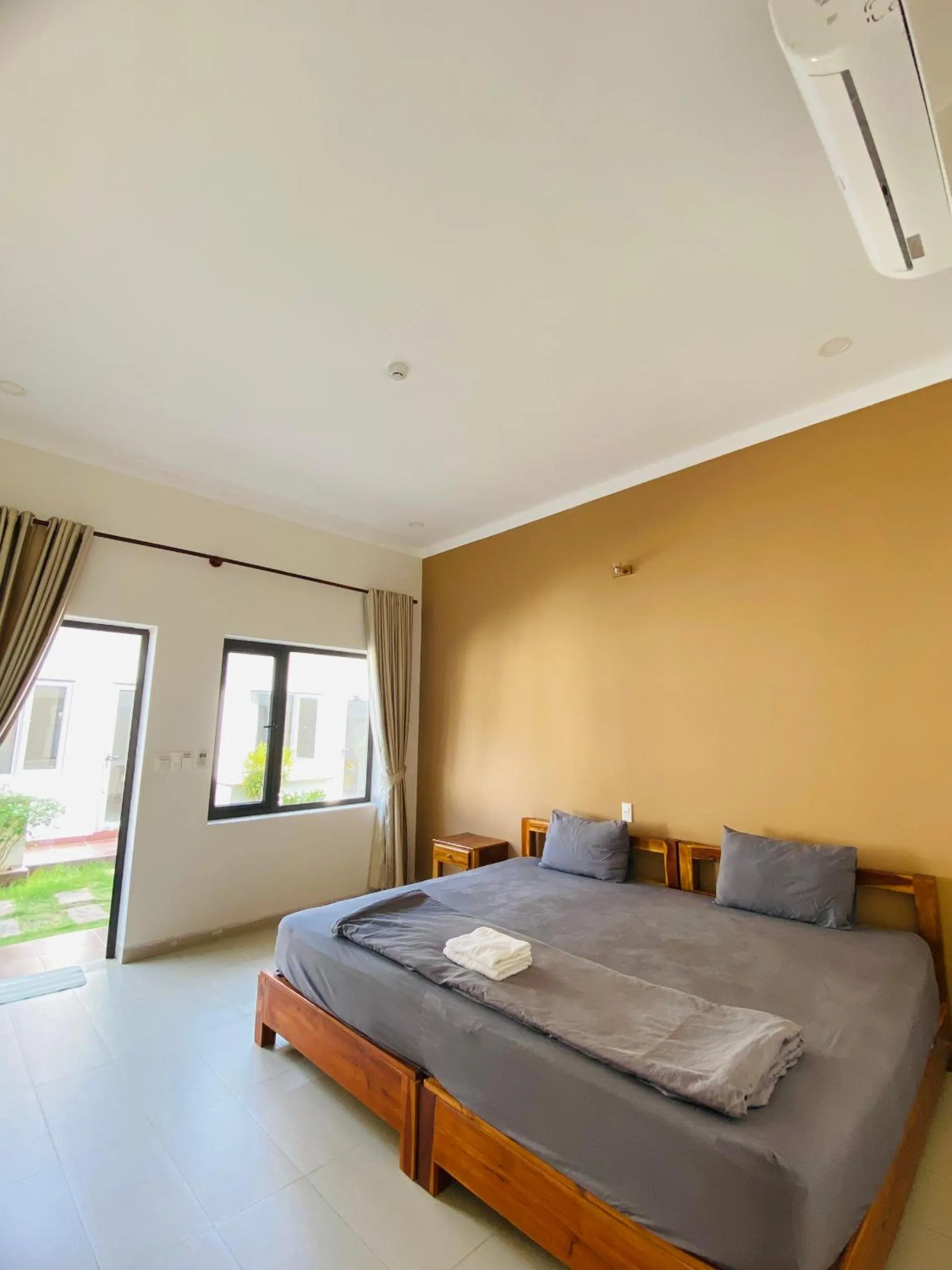 Bed in ARECA MUINE HOMESTAY