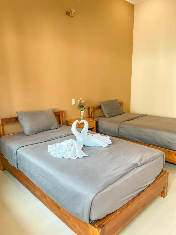 Bed in ARECA MUINE HOMESTAY
