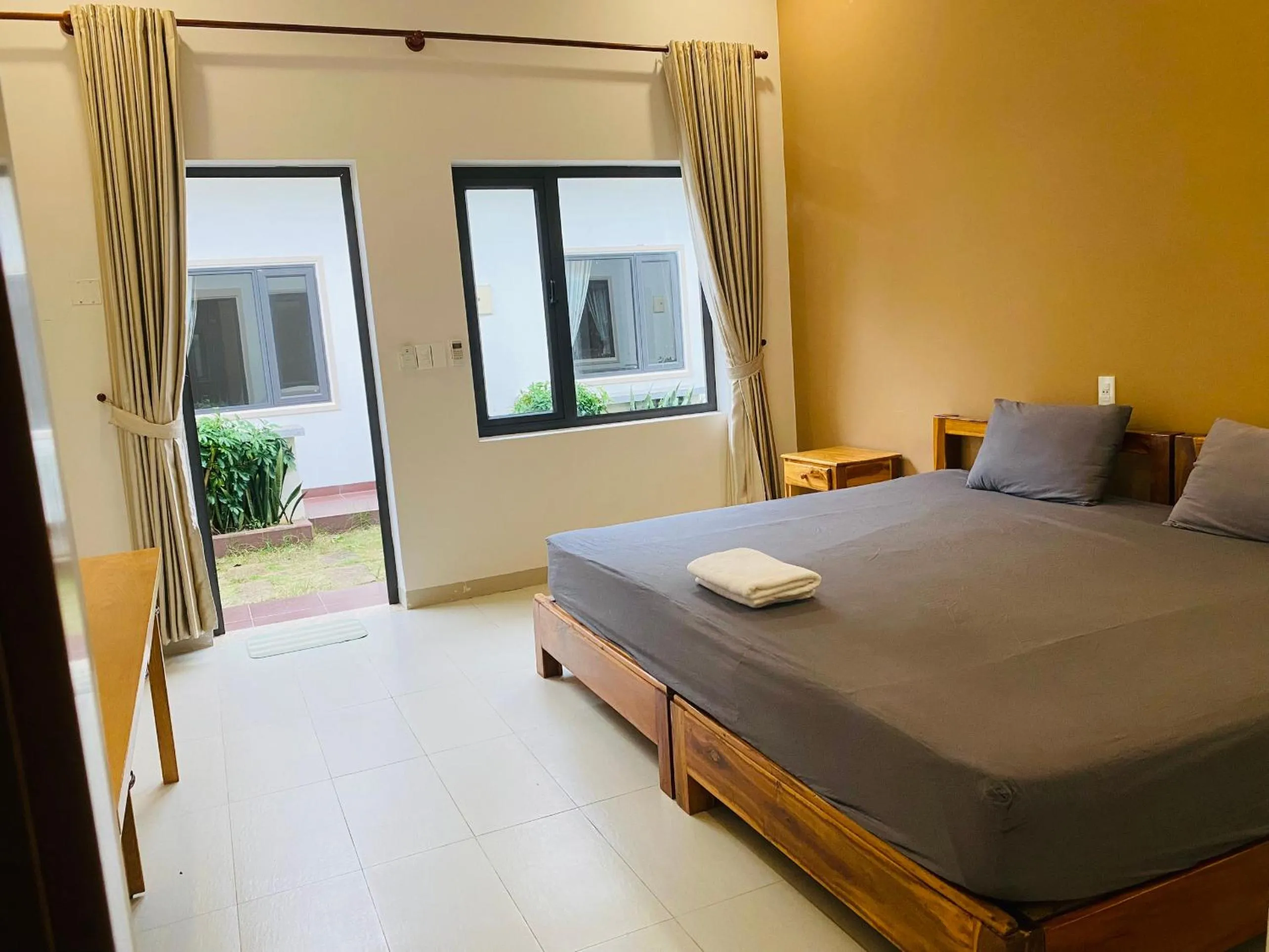 Bed in ARECA MUINE HOMESTAY