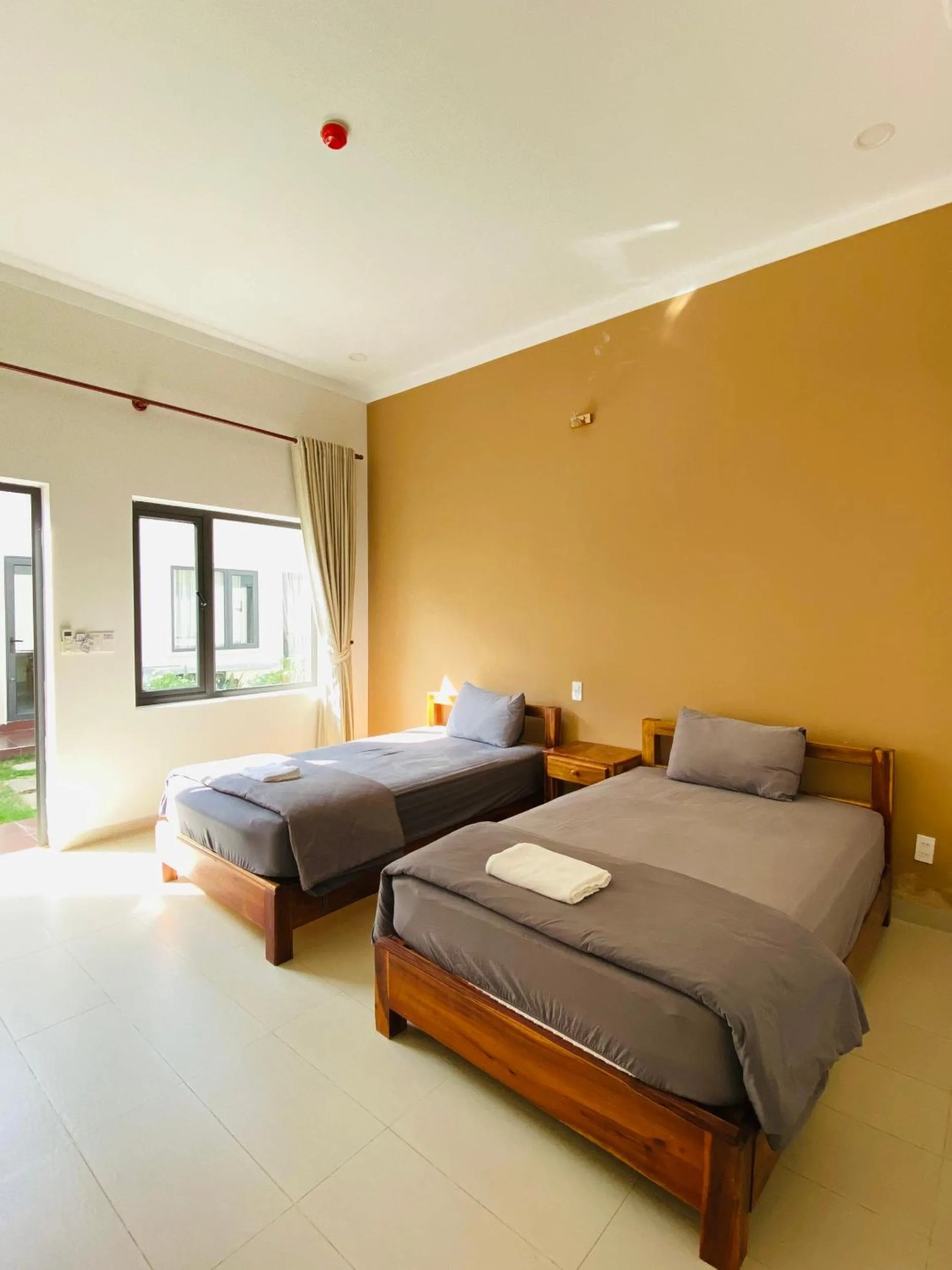 Bed in ARECA MUINE HOMESTAY