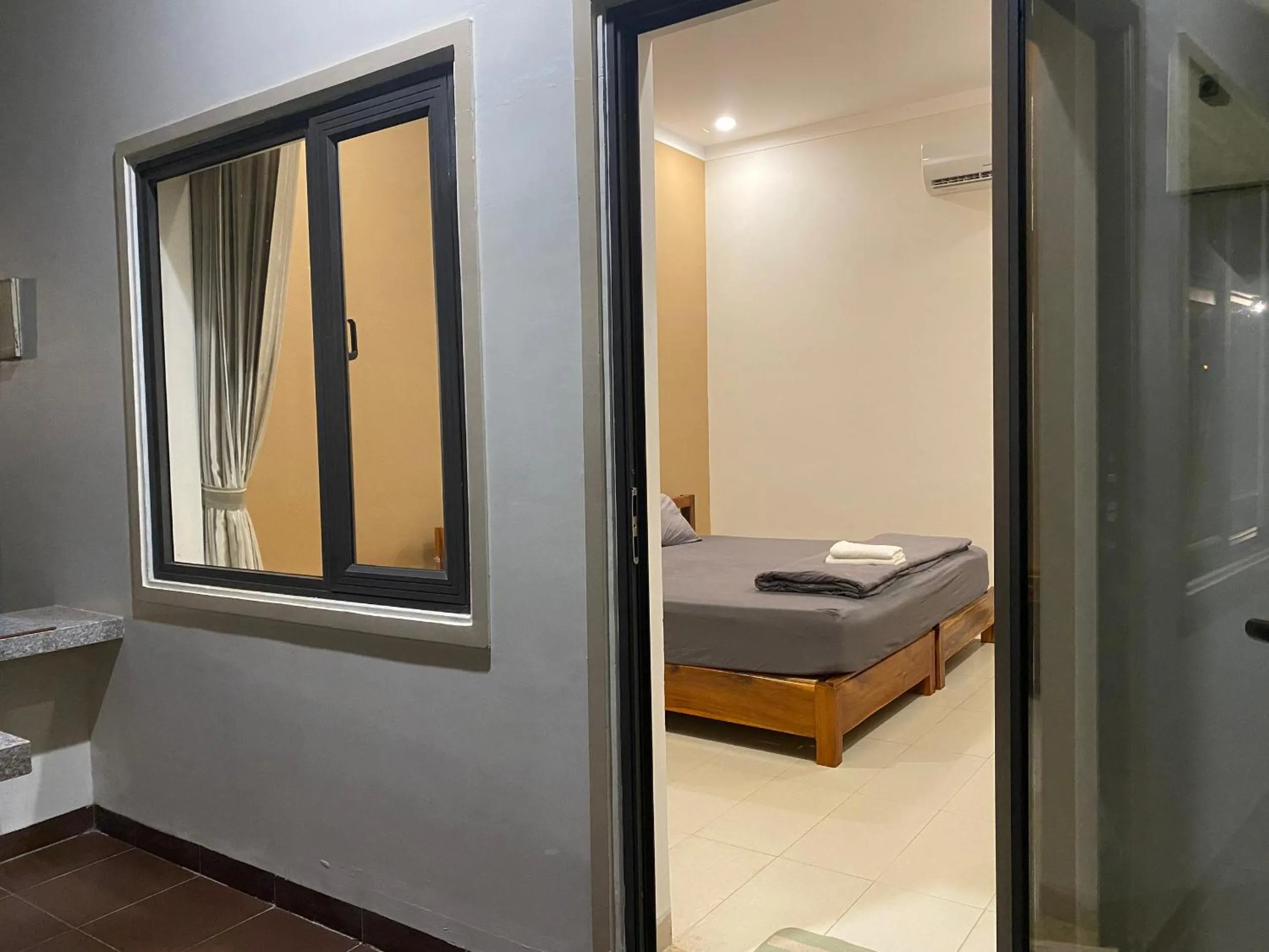 Bed in ARECA MUINE HOMESTAY